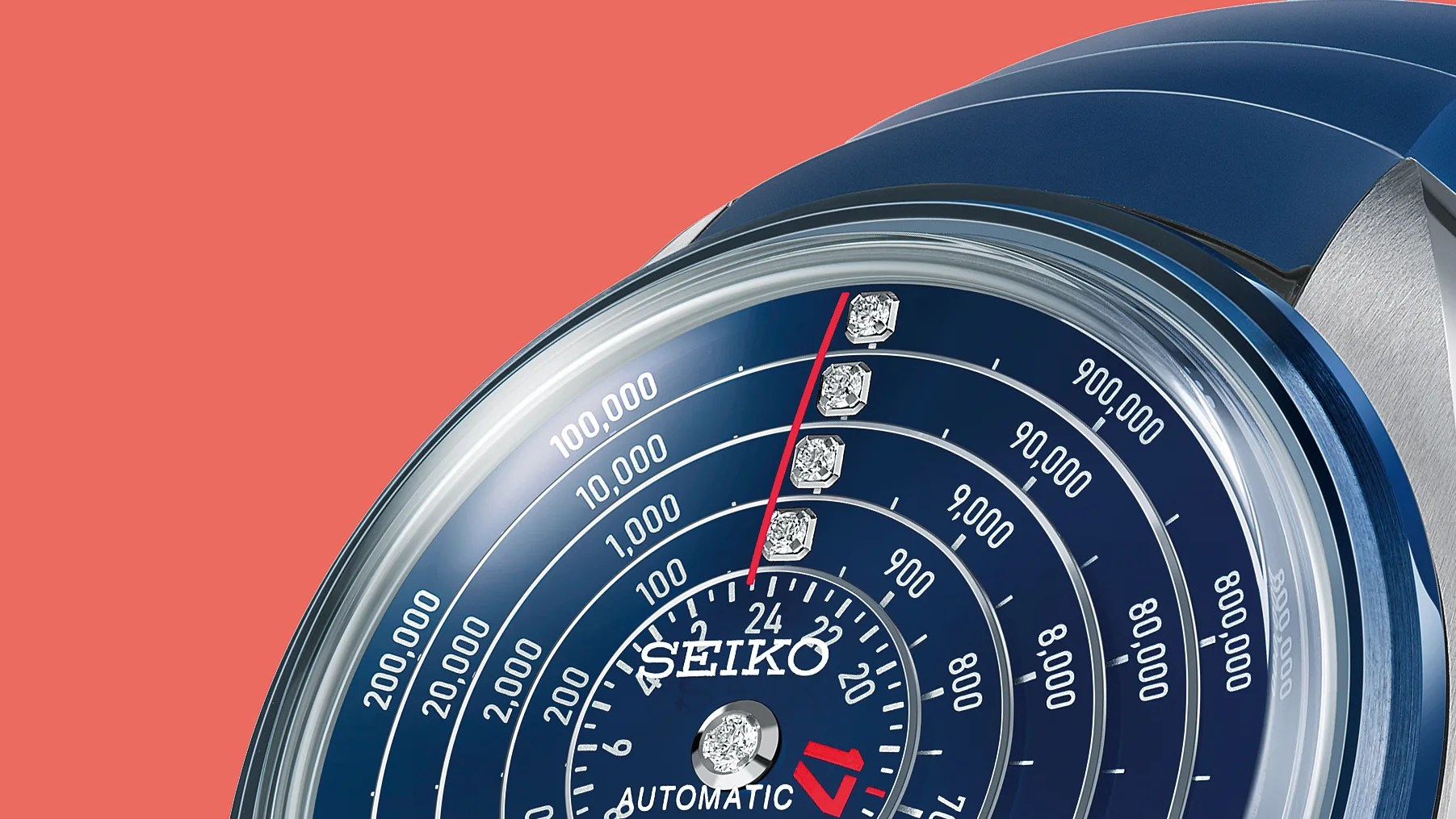 Close-up of a blue Seiko automatic watch dial with concentric circular scales and diamond hour markers.