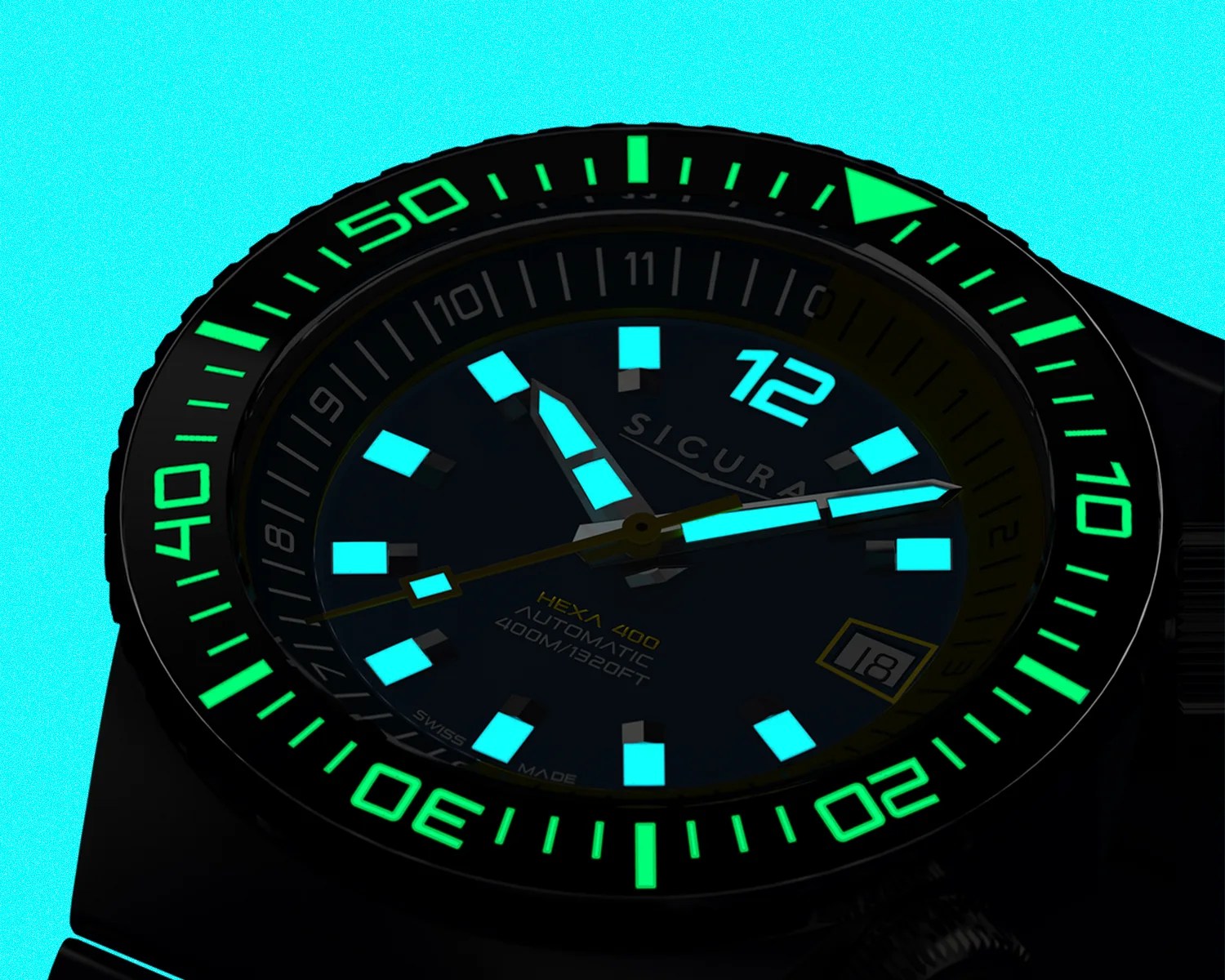 Black dive watch with glowing blue hour markers and hands, green bezel numerals, and date window at 3 o'clock.