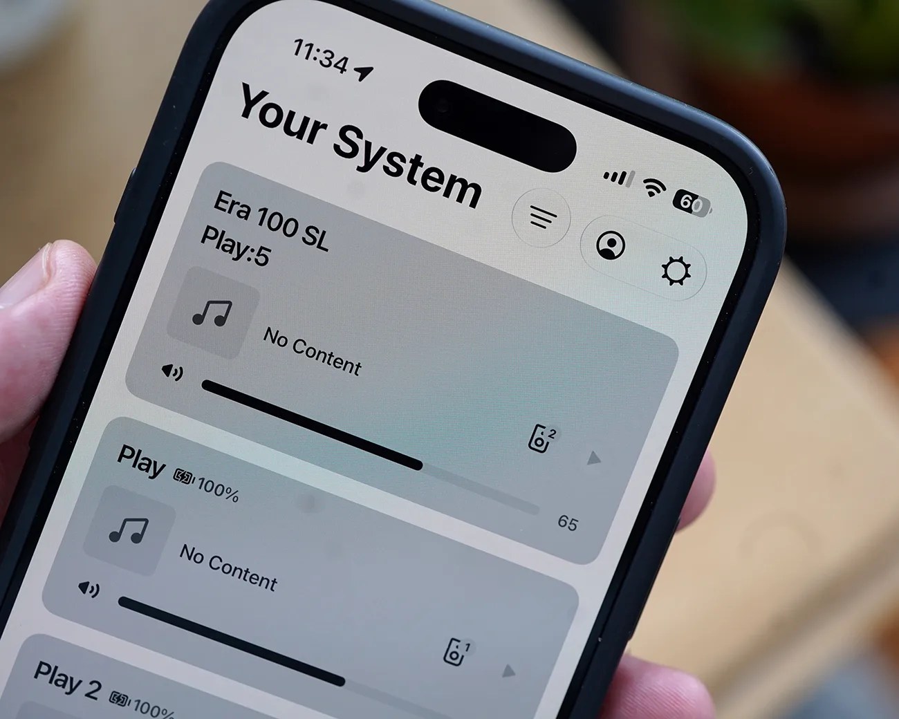 Smartphone screen showing a music system app interface with volume controls and no content playing.