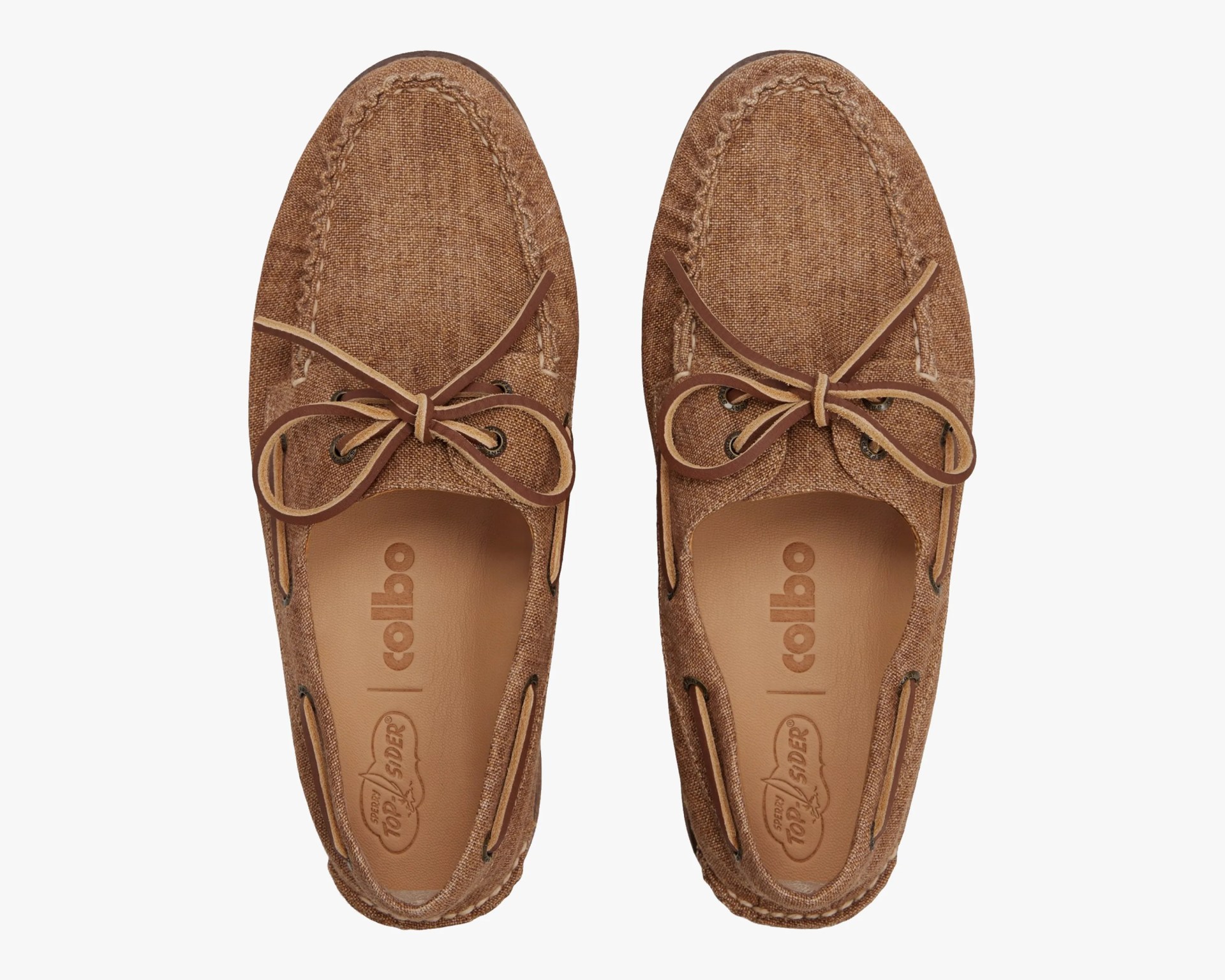 Pair of brown textured fabric boat shoes with leather laces tied in bows, viewed from above.