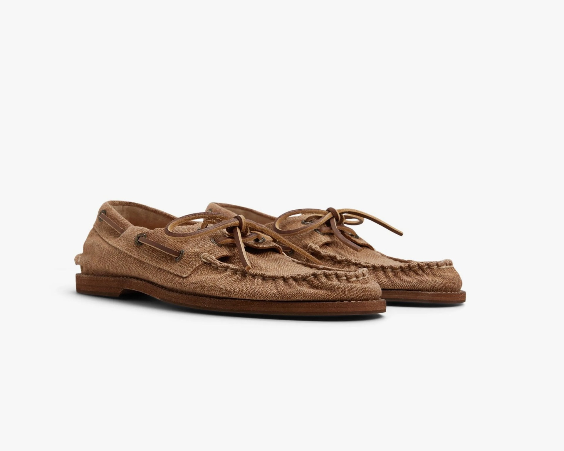 Brown textured fabric moccasin loafers with leather laces and wooden soles.