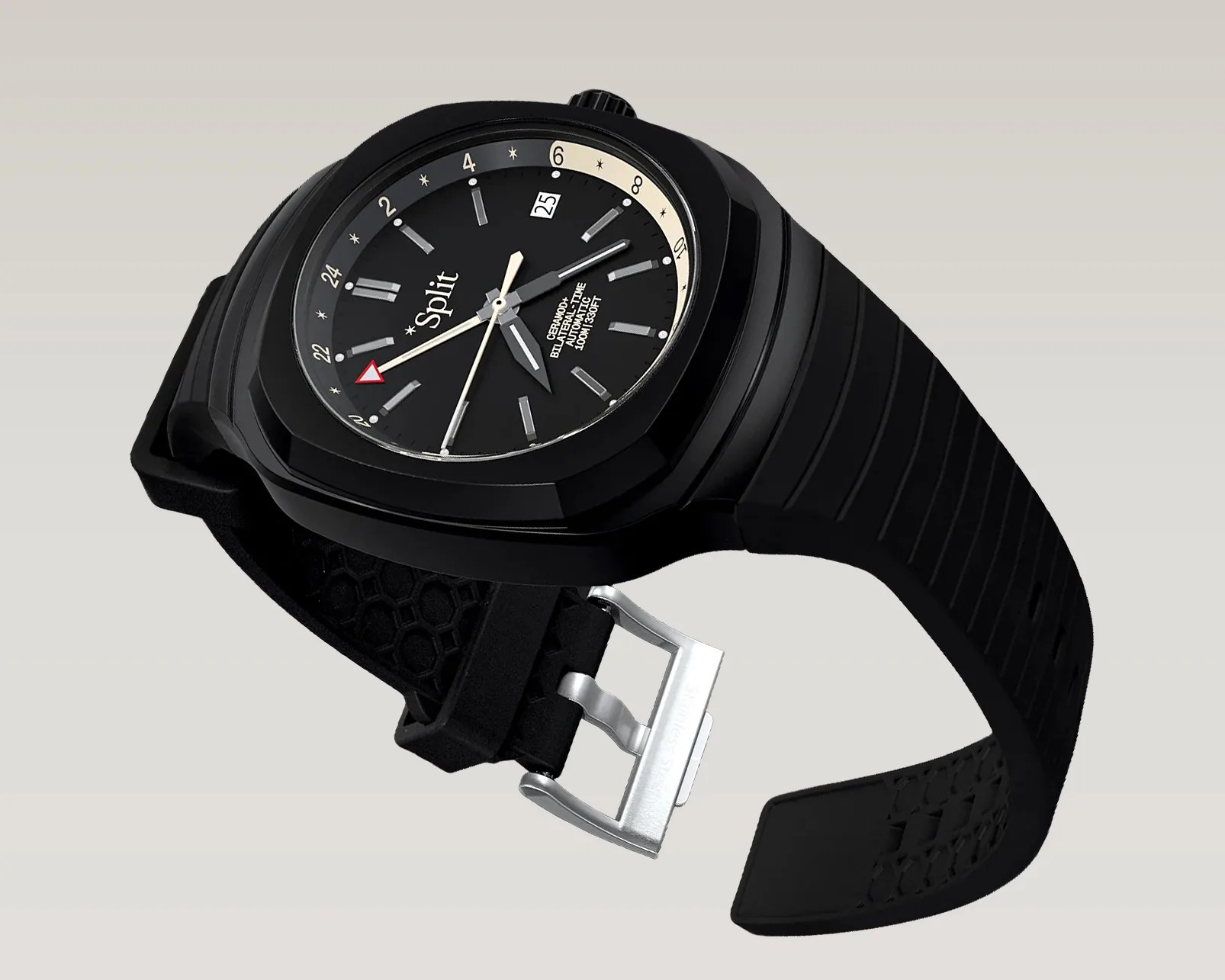 Black ceramic wristwatch with black dial, silver hour markers, date window, and black rubber strap with silver buckle.