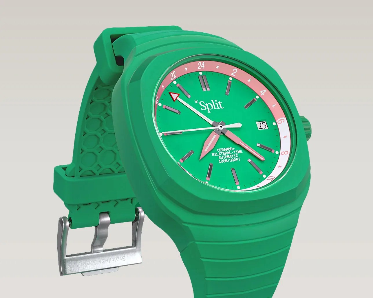 Green wristwatch with a green dial, pink and white 24-hour ring, and stainless steel buckle.