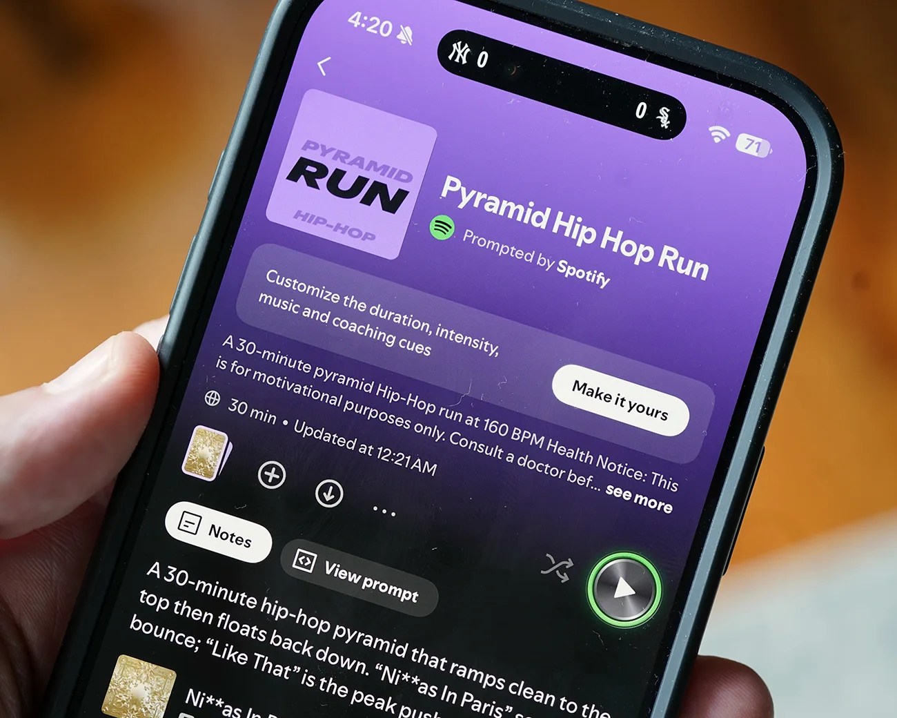 Smartphone screen showing the Spotify app with the "Pyramid Hip Hop Run" playlist open, featuring a purple background and playback controls.