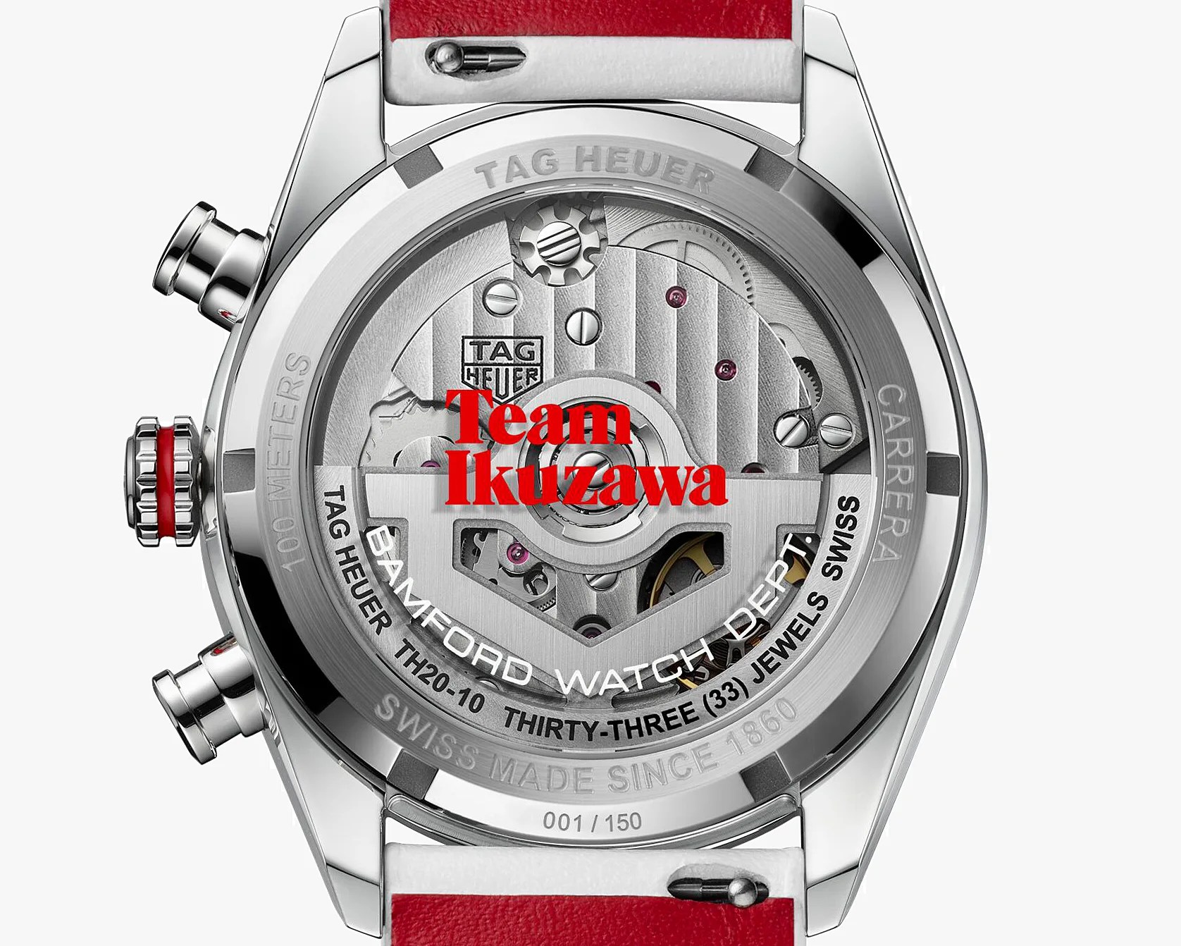 Back of a TAG Heuer Carrera watch with visible mechanical movement and red "Team Ikuzawa" text on the glass.