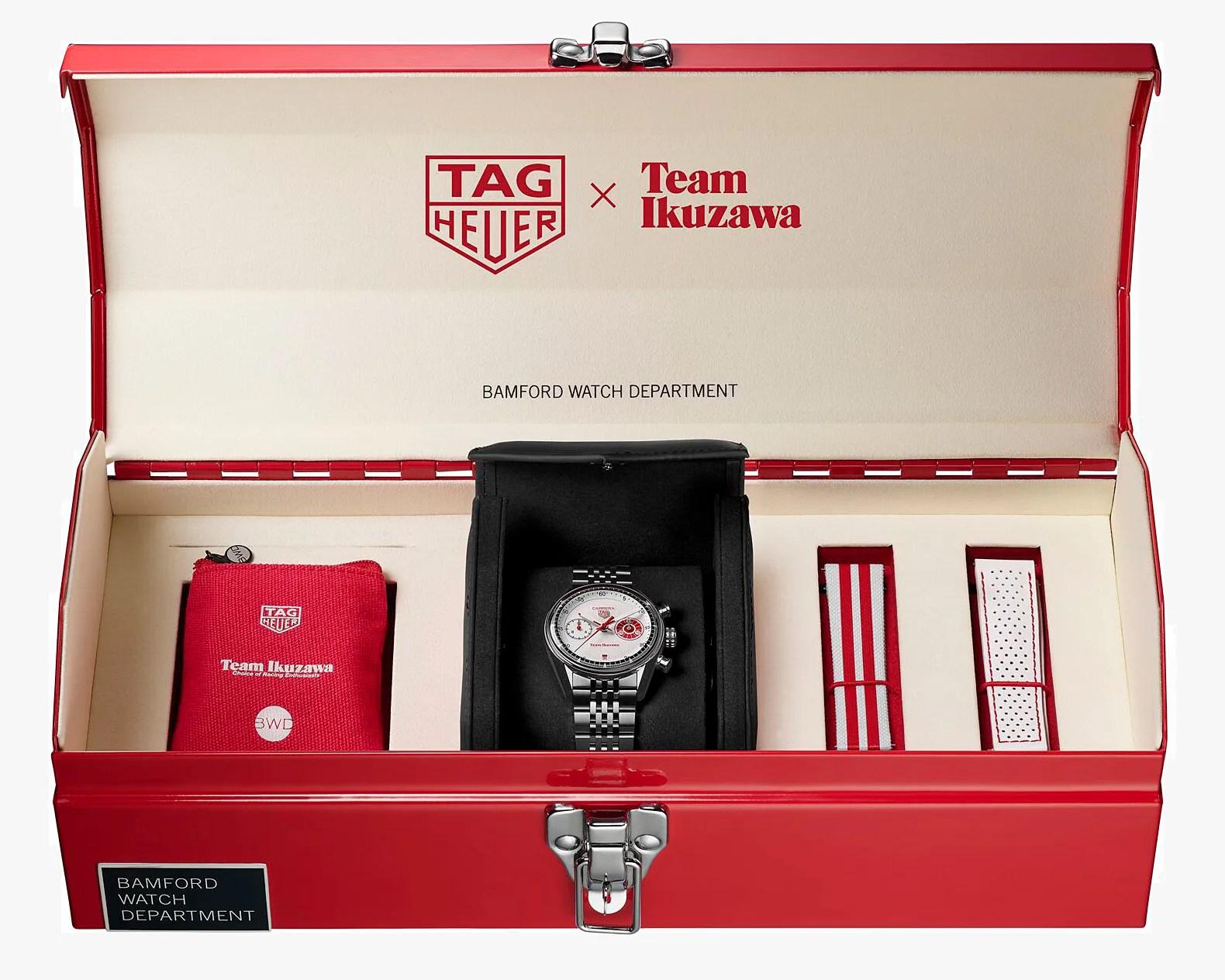 Red metal watch case with TAG Heuer x Team Ikuzawa branding, containing a silver watch with a metal bracelet, a red pouch, and two extra watch straps.