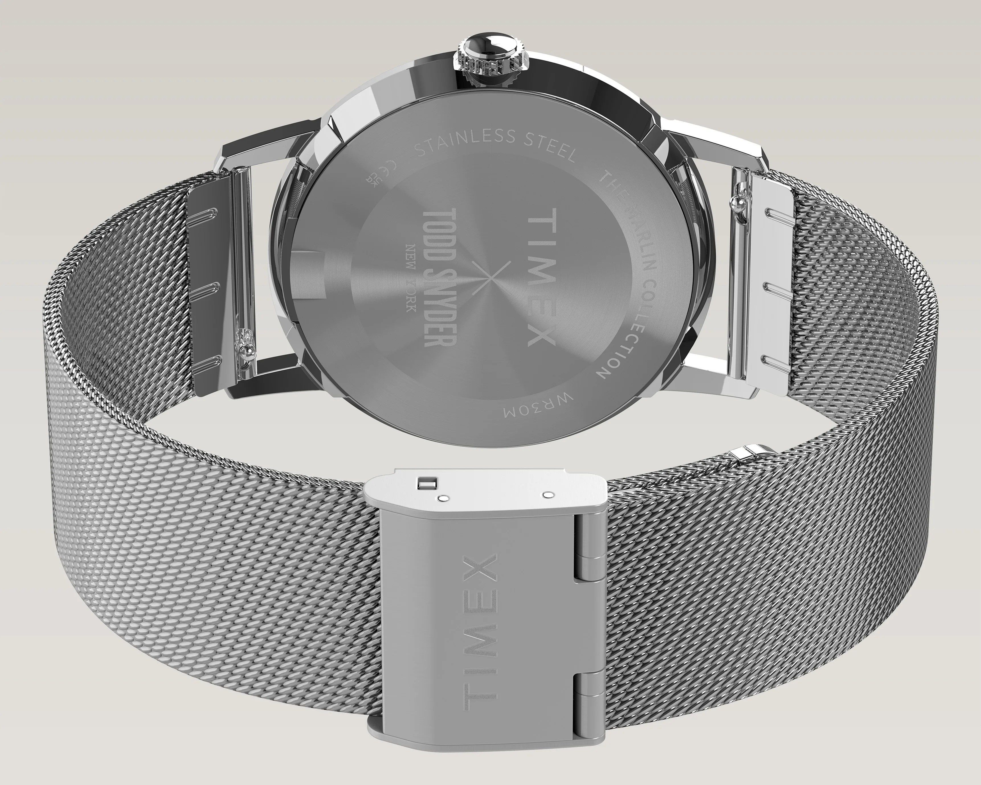 Silver stainless steel mesh watch band with Timex clasp and engraved watch backplate.