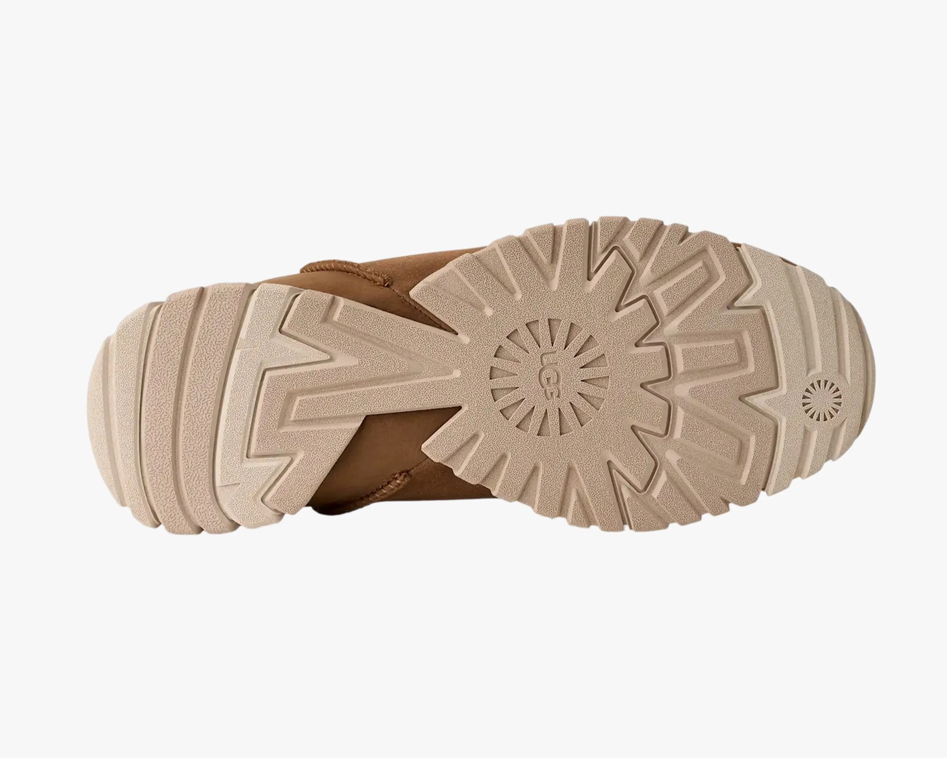 Beige rubber sole with deep treads and UGG logo on a brown shoe.