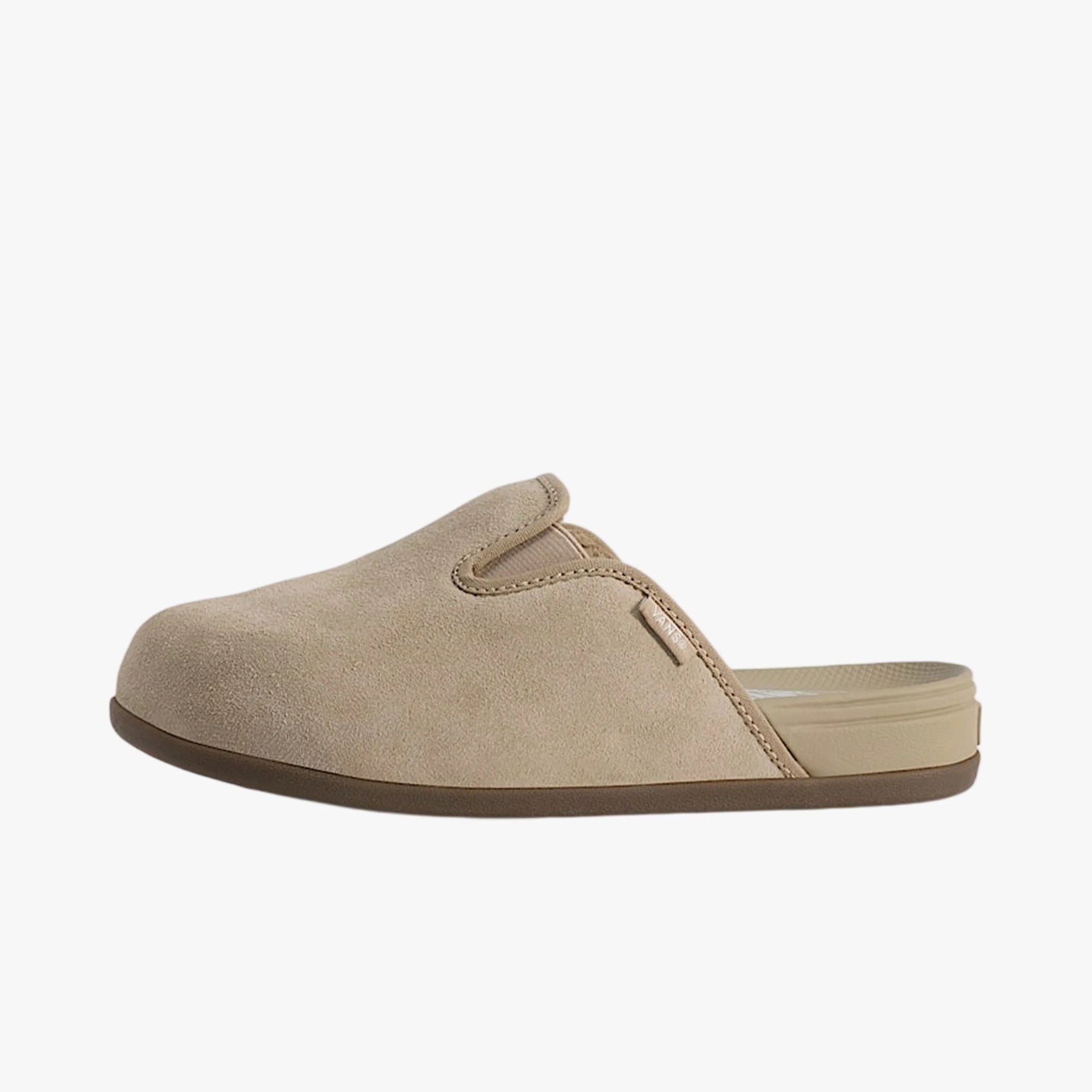 Beige suede slip-on clog with a brown sole and a small Vans logo tag on the side.