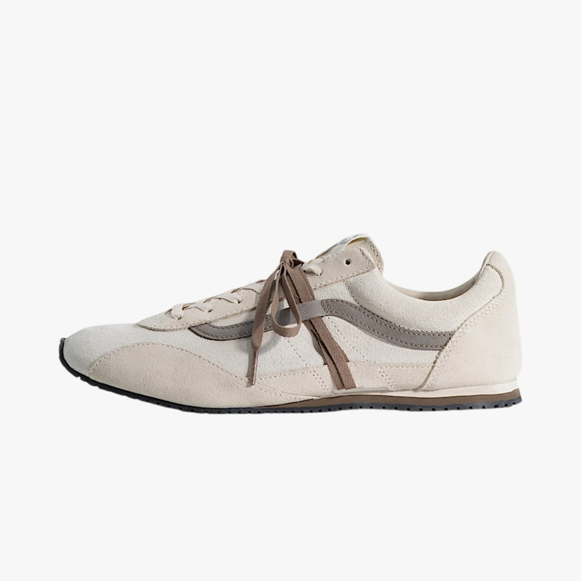 Beige suede sneaker with brown laces and gray side stripe on a white background.