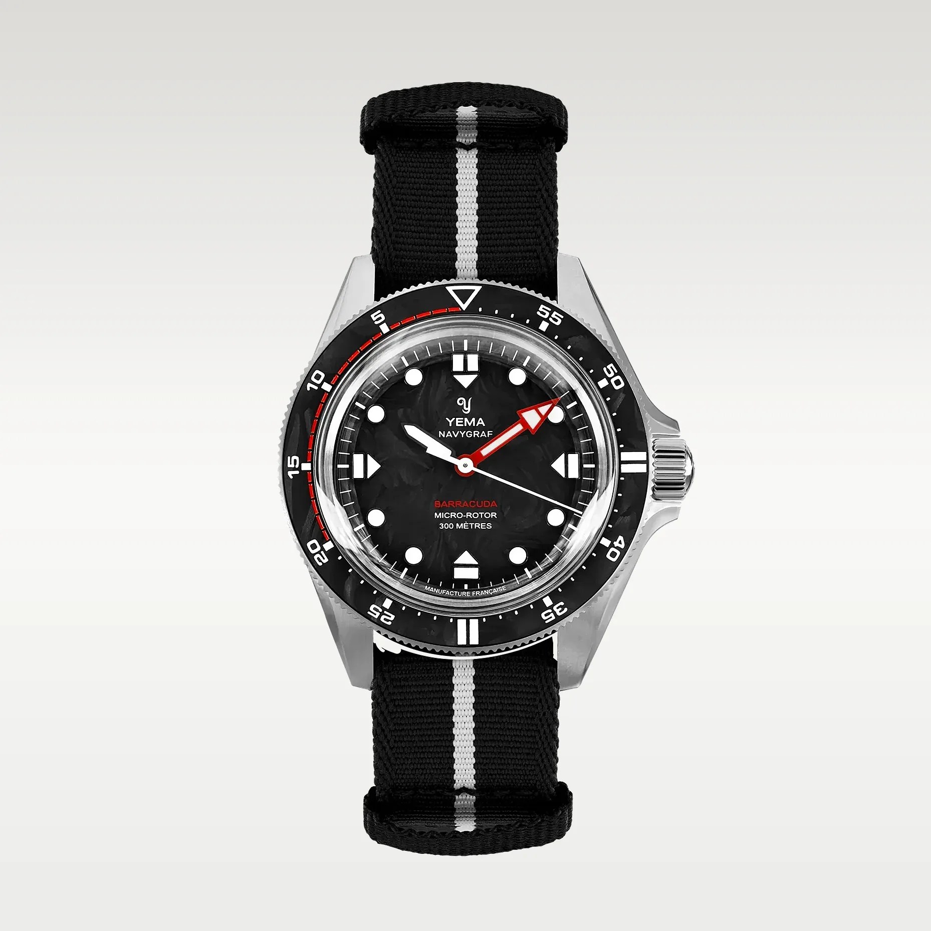 Black Yema Navygraf Barracuda wristwatch with red and white hands, black bezel, and black fabric strap with white stripe.