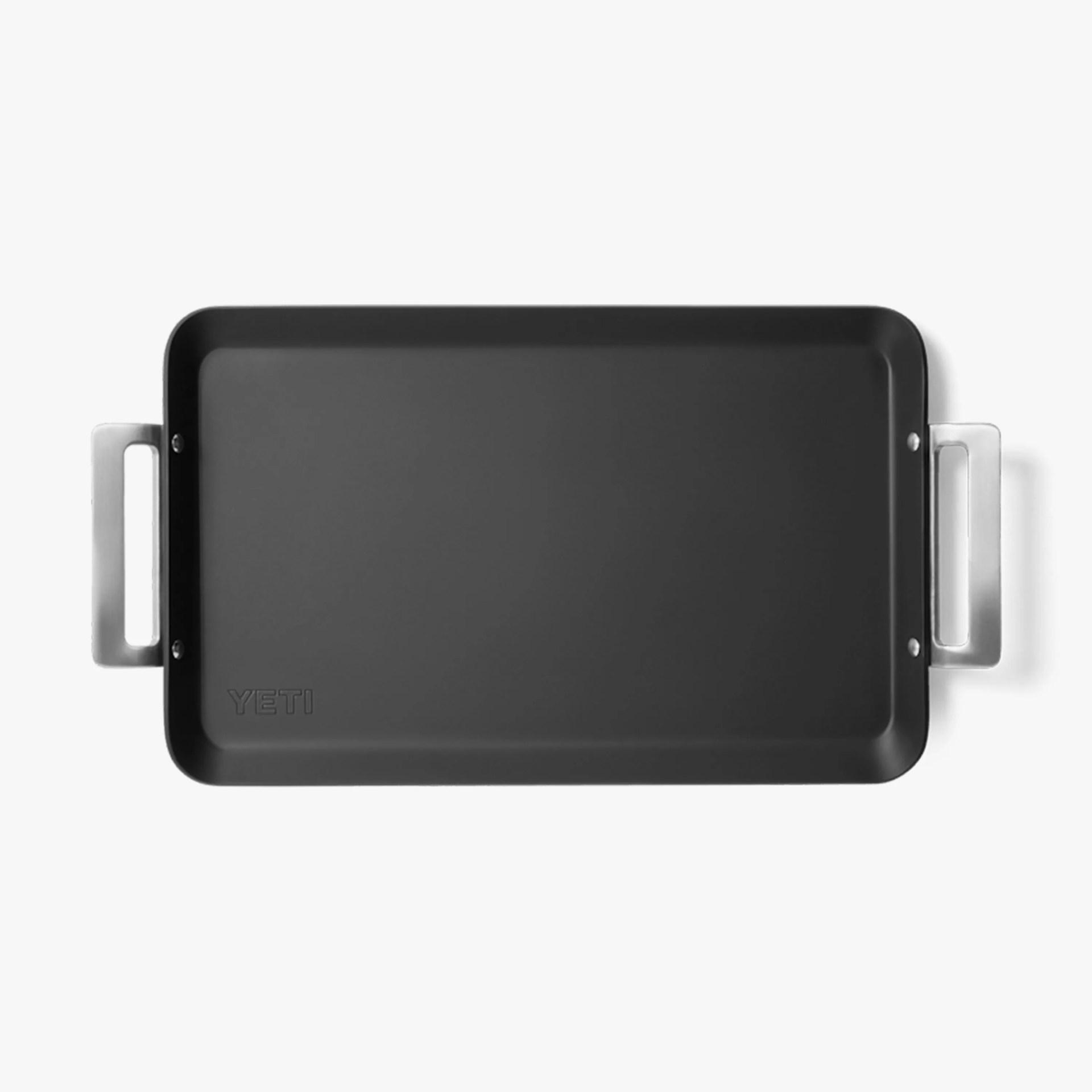 Rectangular black YETI griddle with silver handles on a white background.