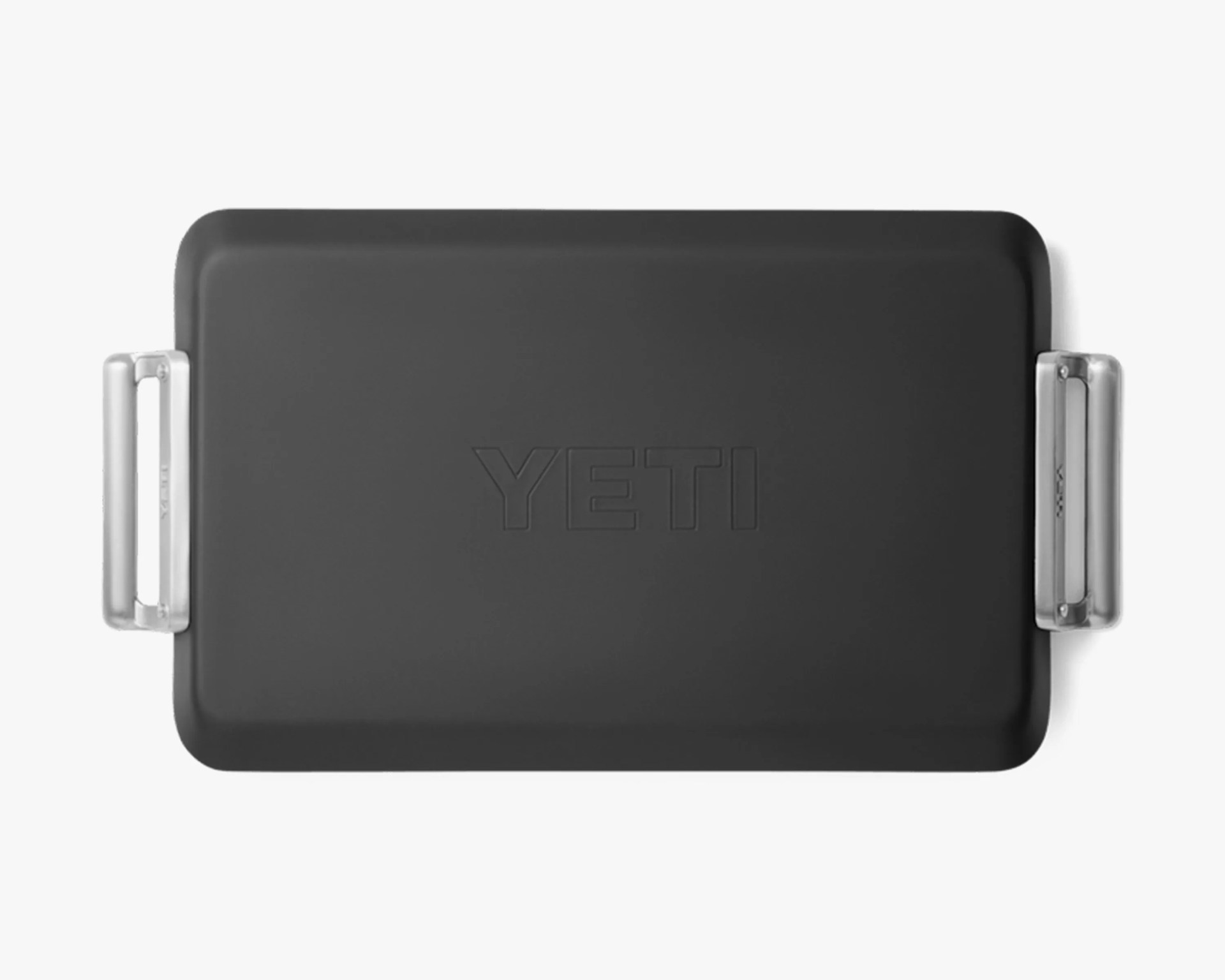 Black rectangular YETI cooler lid with silver metal handles on each side.