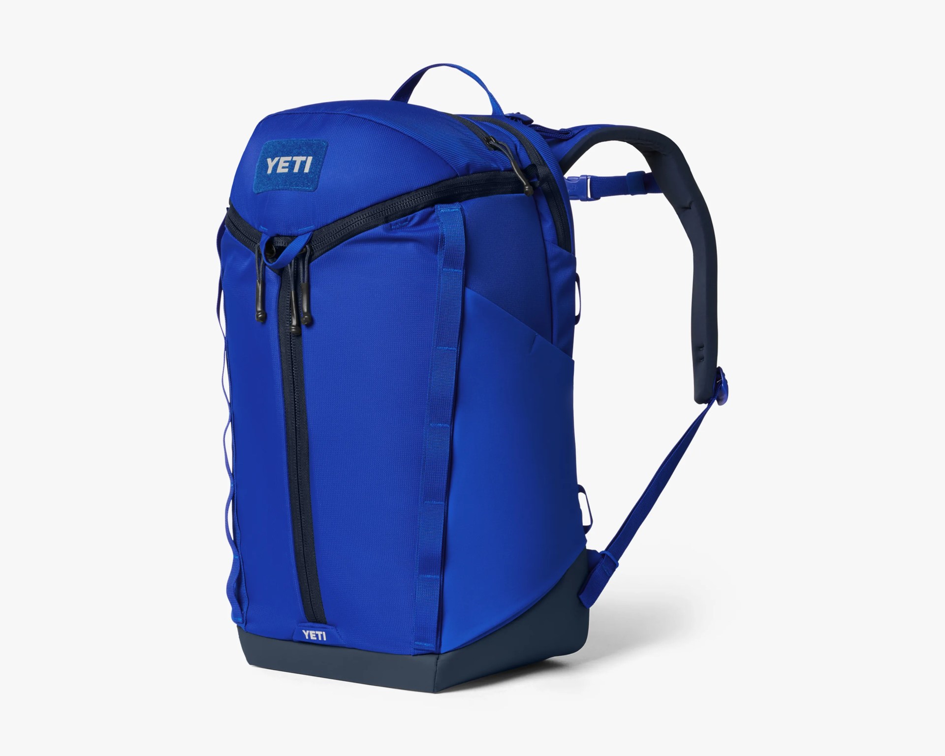 Blue YETI backpack with black zippers and padded shoulder straps on a white background.