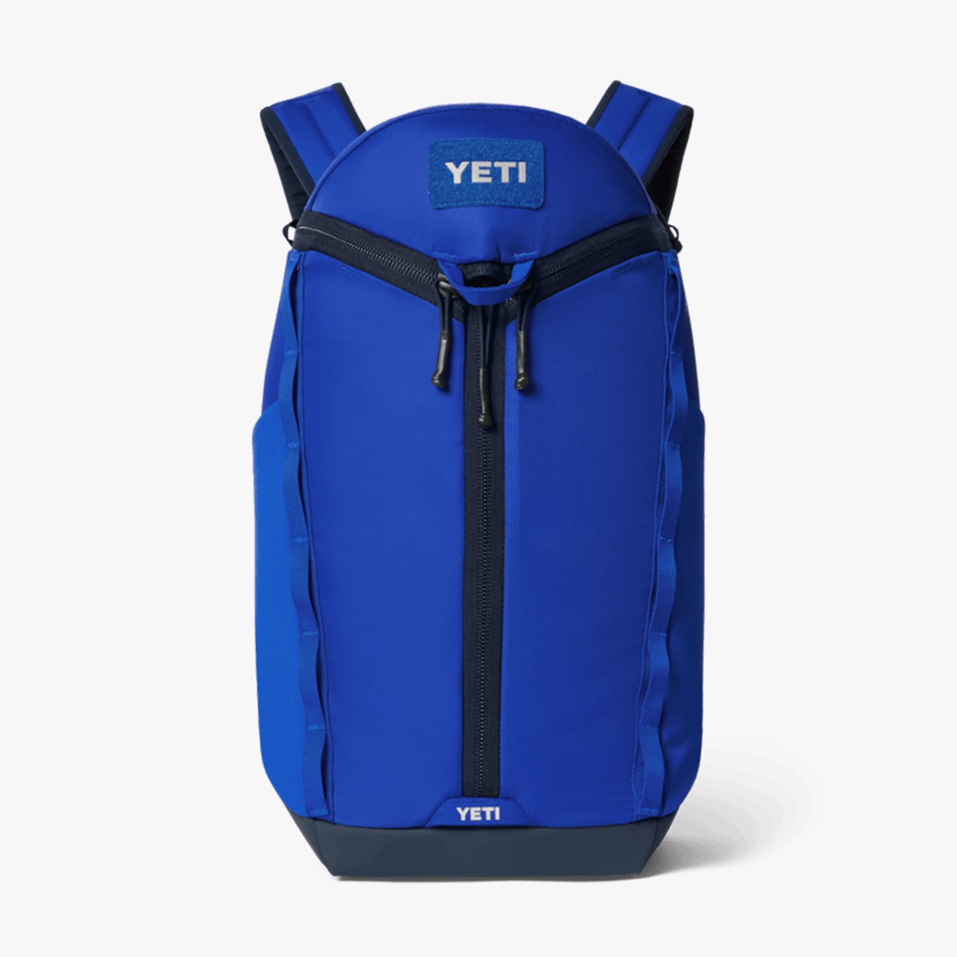 Blue YETI backpack with black zipper and padded shoulder straps on a white background.