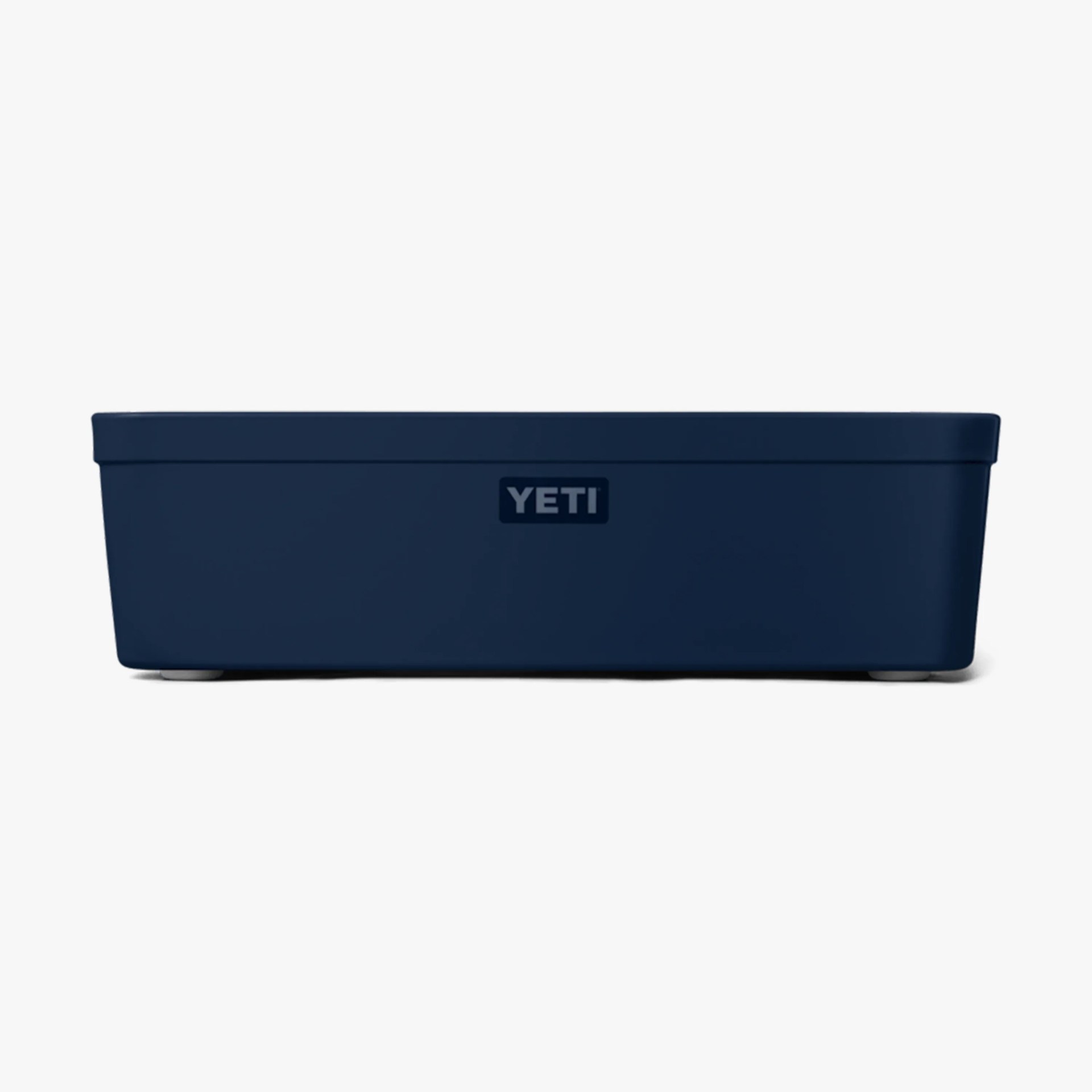 Navy blue rectangular YETI cooler with a flat lid and small feet.
