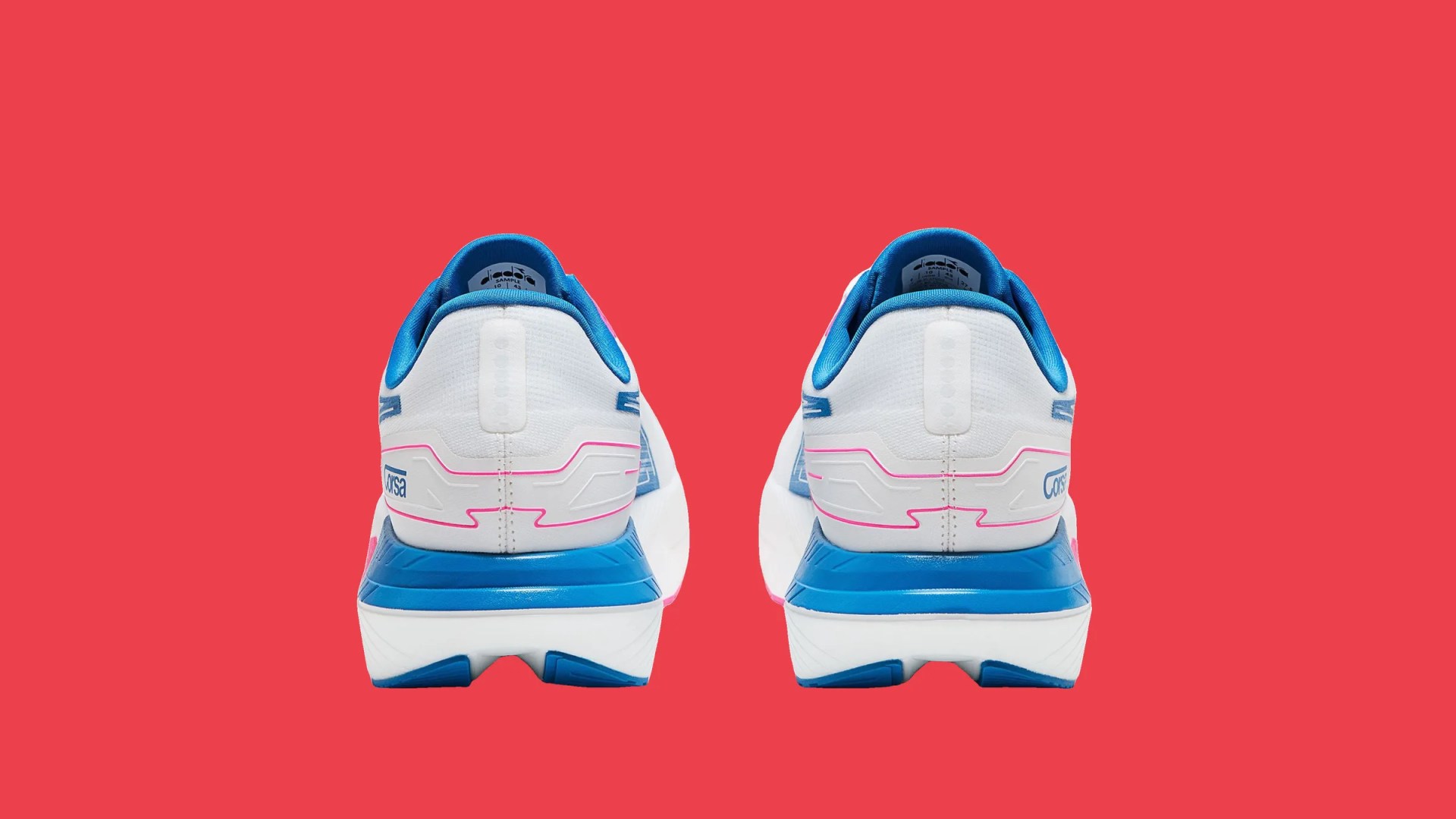 Pair of white running shoes with blue and pink accents shown from the back on a red background.