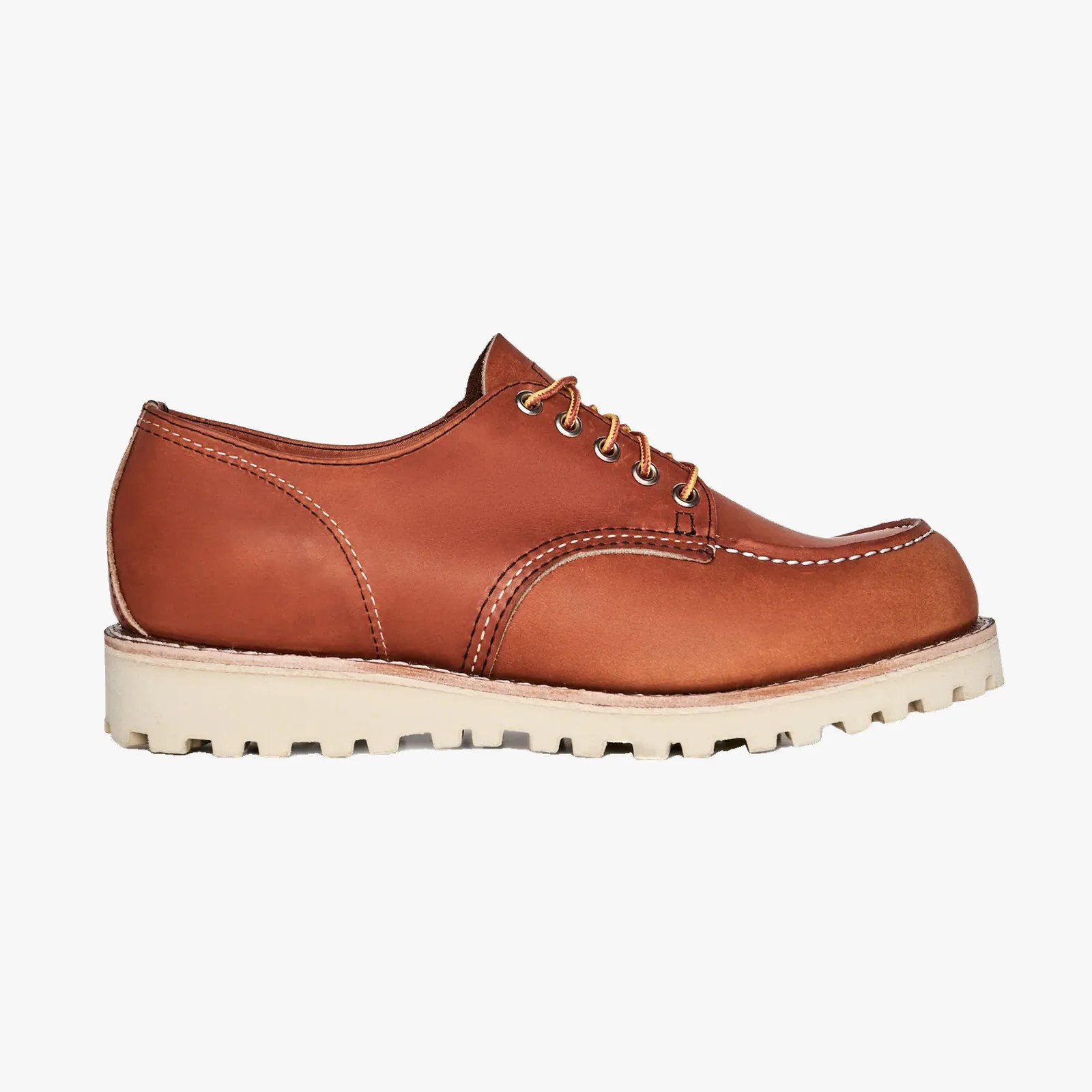 Brown leather lace-up shoe with white stitching and thick white lug sole.