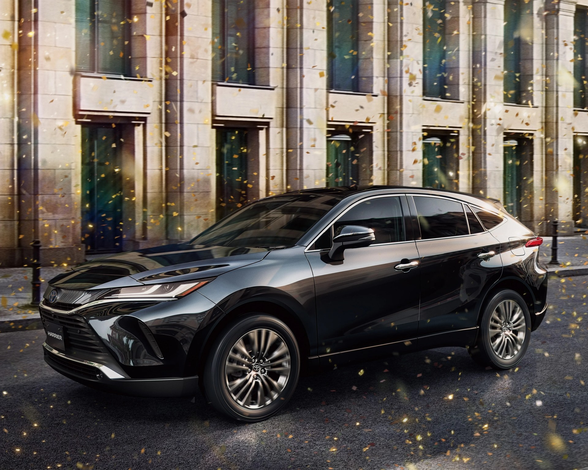 Black Toyota Harrier SUV parked on a street with a stone building and golden confetti falling around.