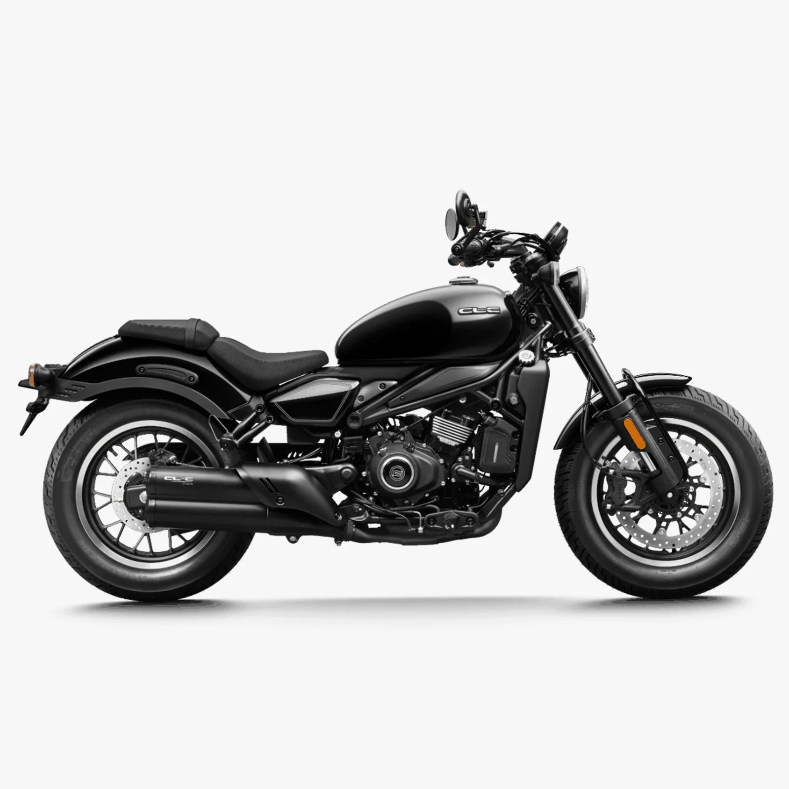 Black cruiser motorcycle with low seat, round headlight, and dual exhaust pipes on a white background.
