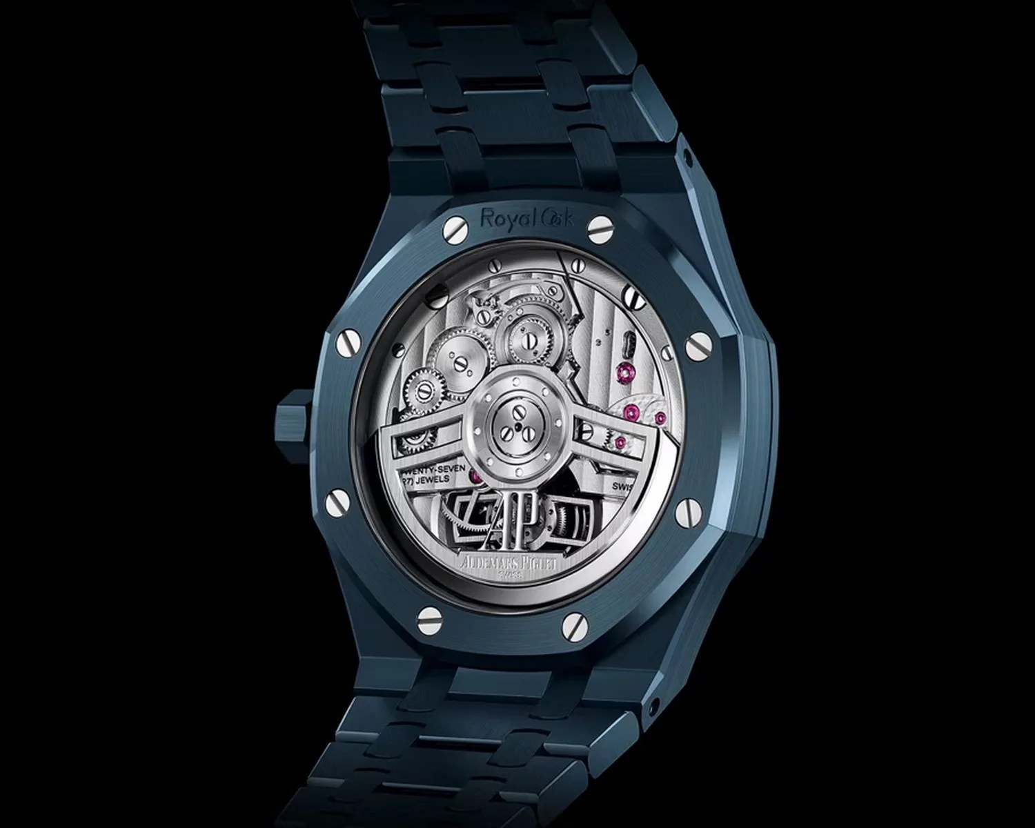 Blue Audemars Piguet Royal Oak watch showing detailed mechanical movement through transparent case back.