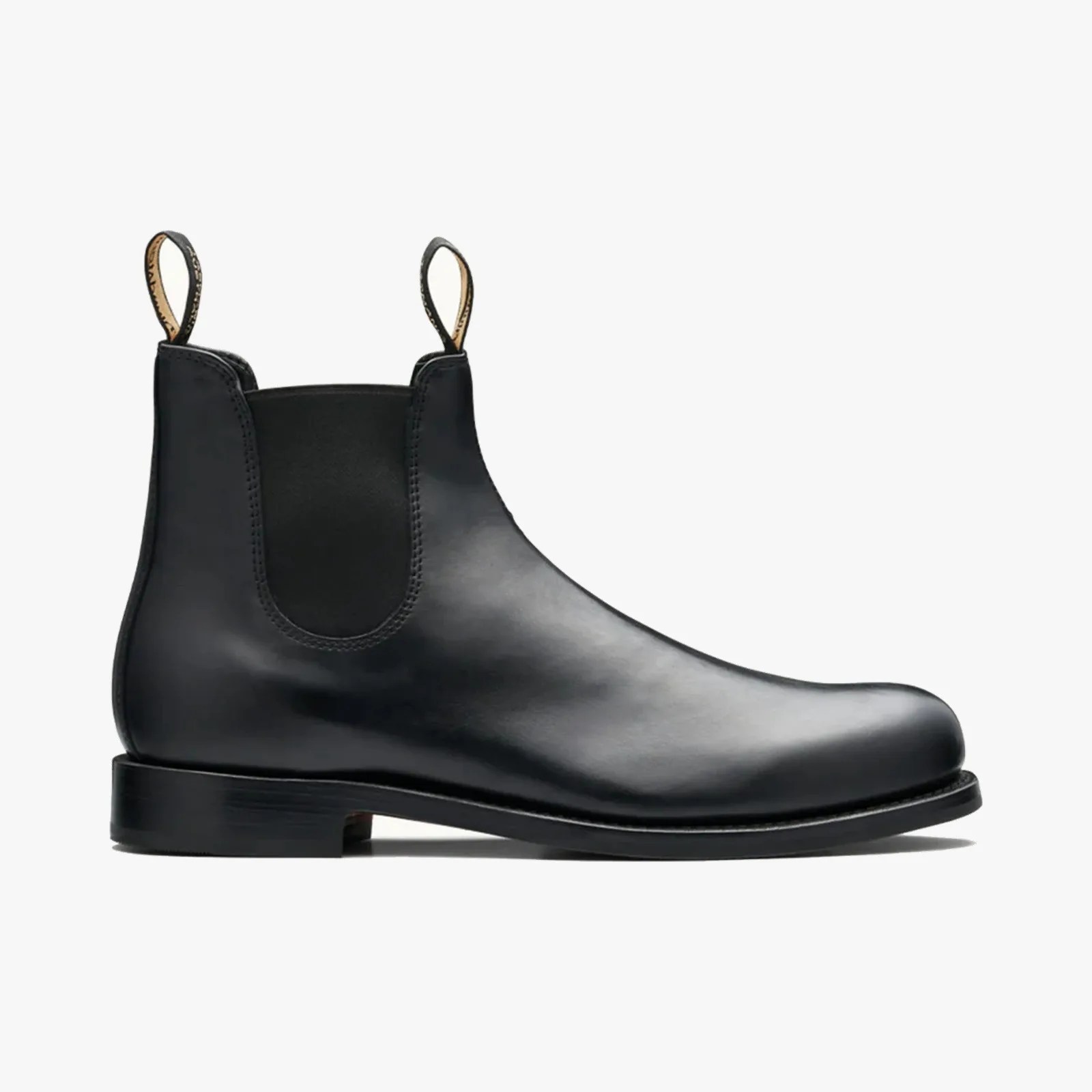 Black leather Chelsea boot with elastic side panels and pull tabs.