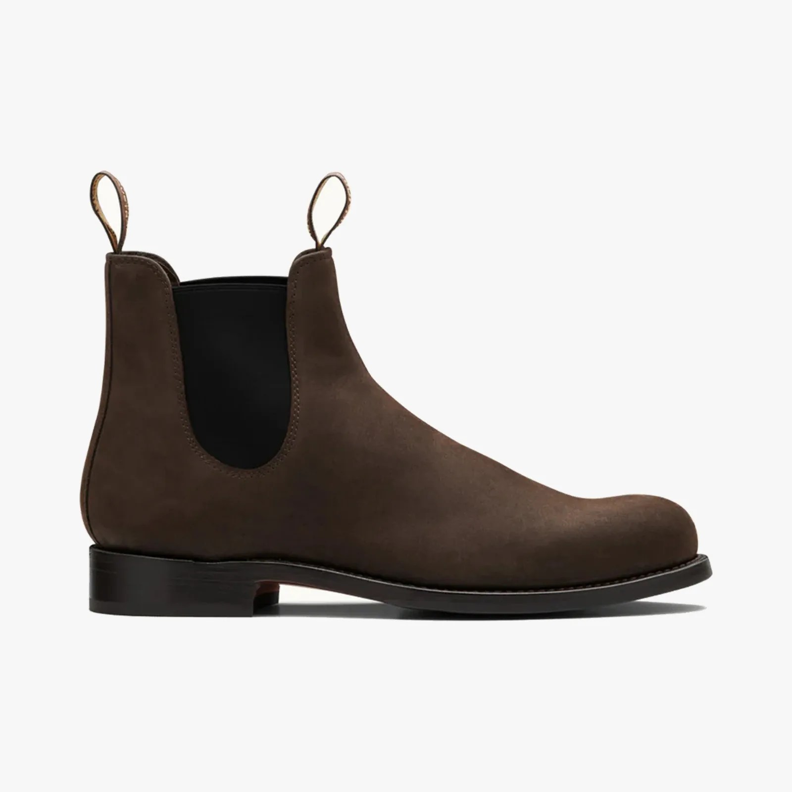 Brown suede Chelsea boot with black elastic side panels and pull tabs on a white background.