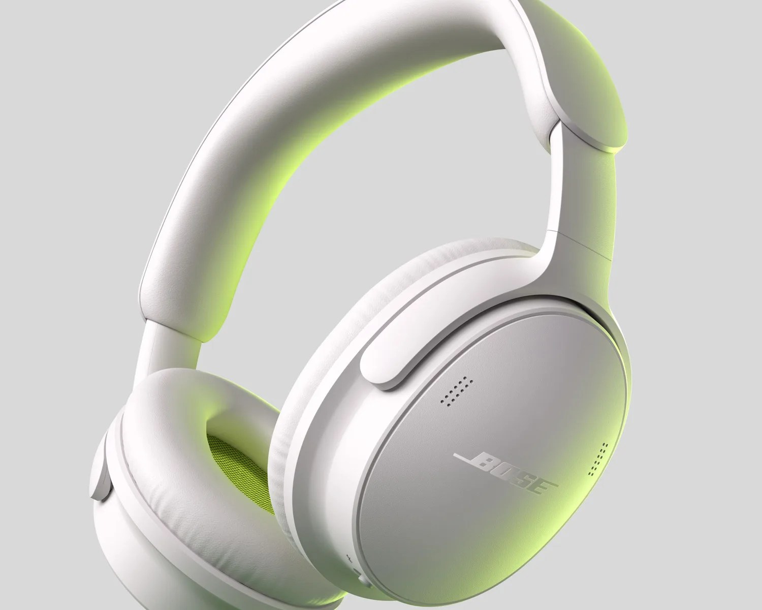 White Bose over-ear headphones with cushioned ear pads and headband, shown against a gray background.