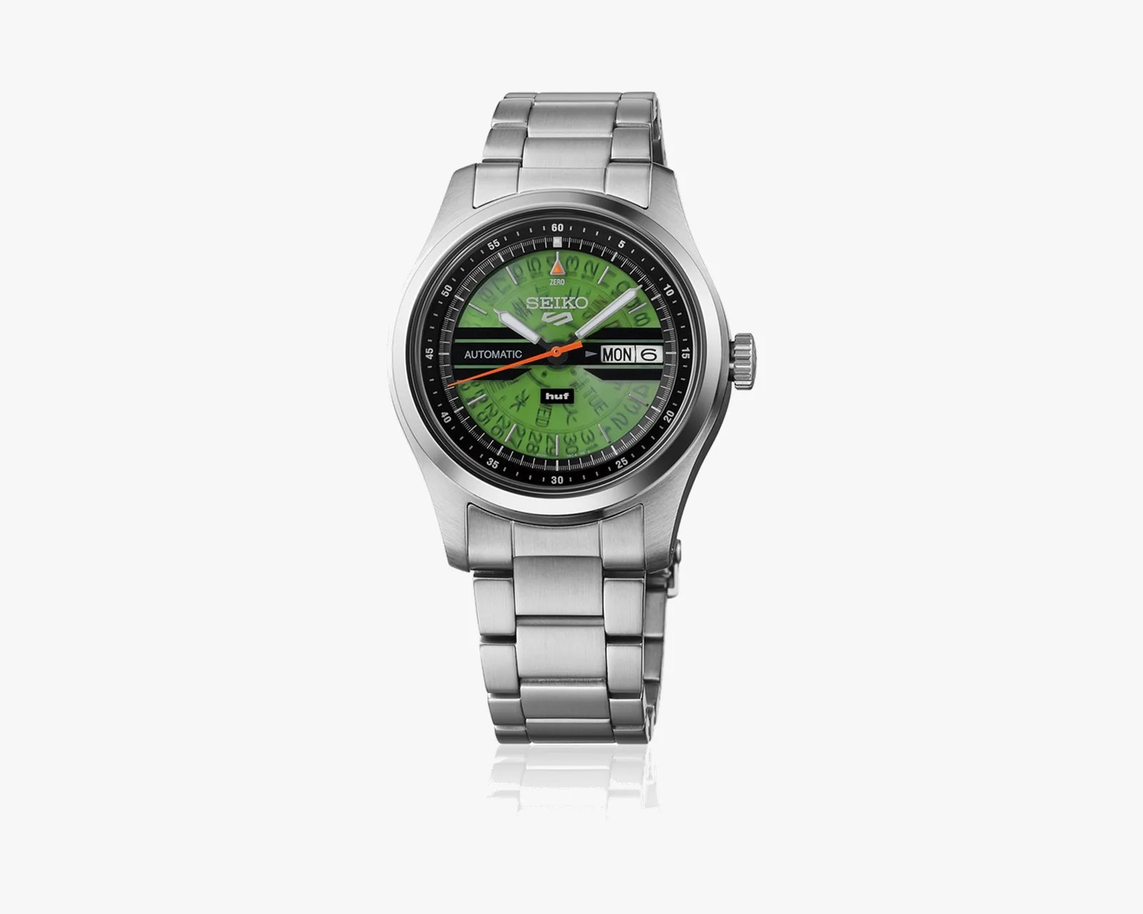 Silver stainless steel Seiko wristwatch with green dial, black accents, and day-date display.