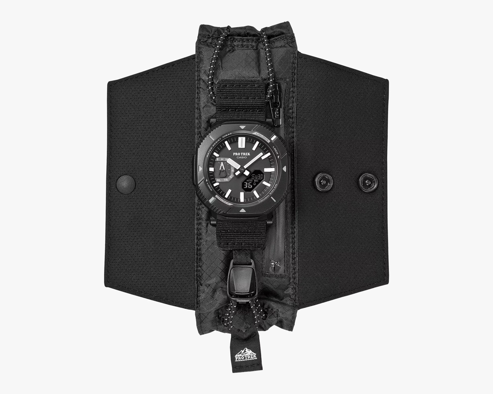 Black Casio Pro Trek watch with analog-digital display attached to a black fabric pouch with zipper and snap buttons.