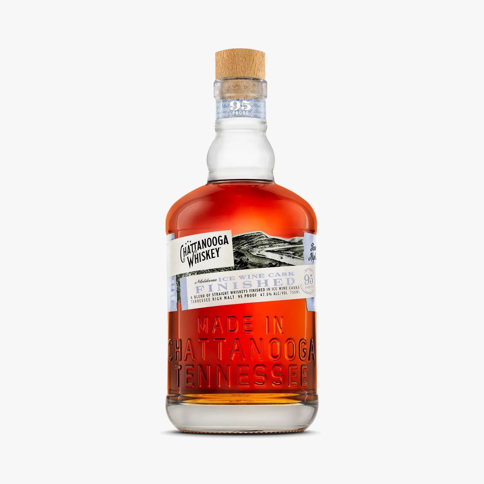 Amber whiskey bottle with wooden cork and embossed "Made in Chattanooga Tennessee" text on the glass.