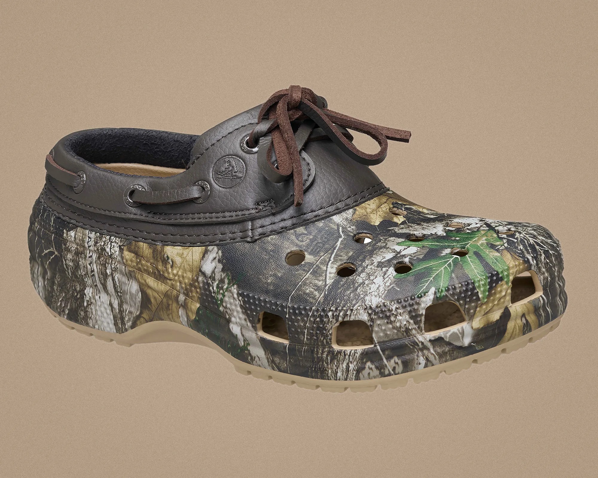 Camouflage-patterned clog with brown leather collar and brown laces on a beige background.