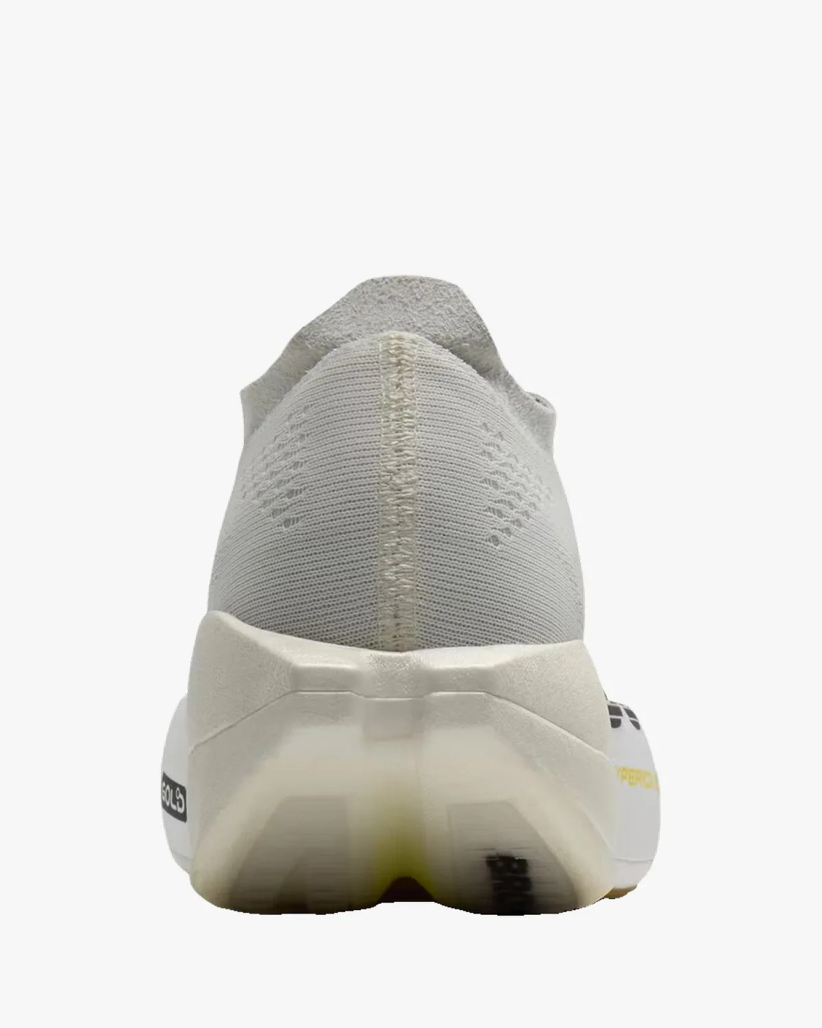 Rear view of a light gray knit running shoe with a white sole and black logo on the heel.