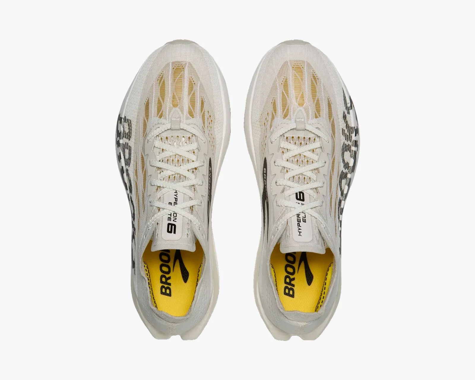 Pair of white Brooks Hyperion Elite 2 running shoes with yellow insoles and black branding, viewed from above.