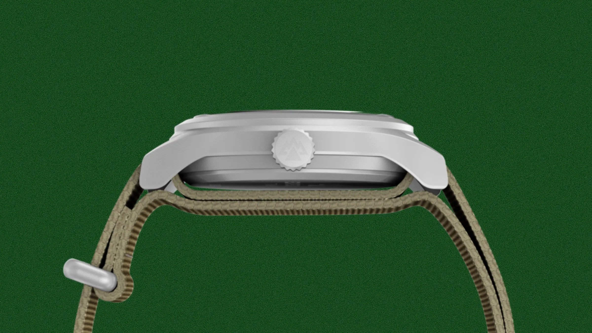 Side view of a silver watch case with a crown featuring a mountain logo and a khaki fabric strap.