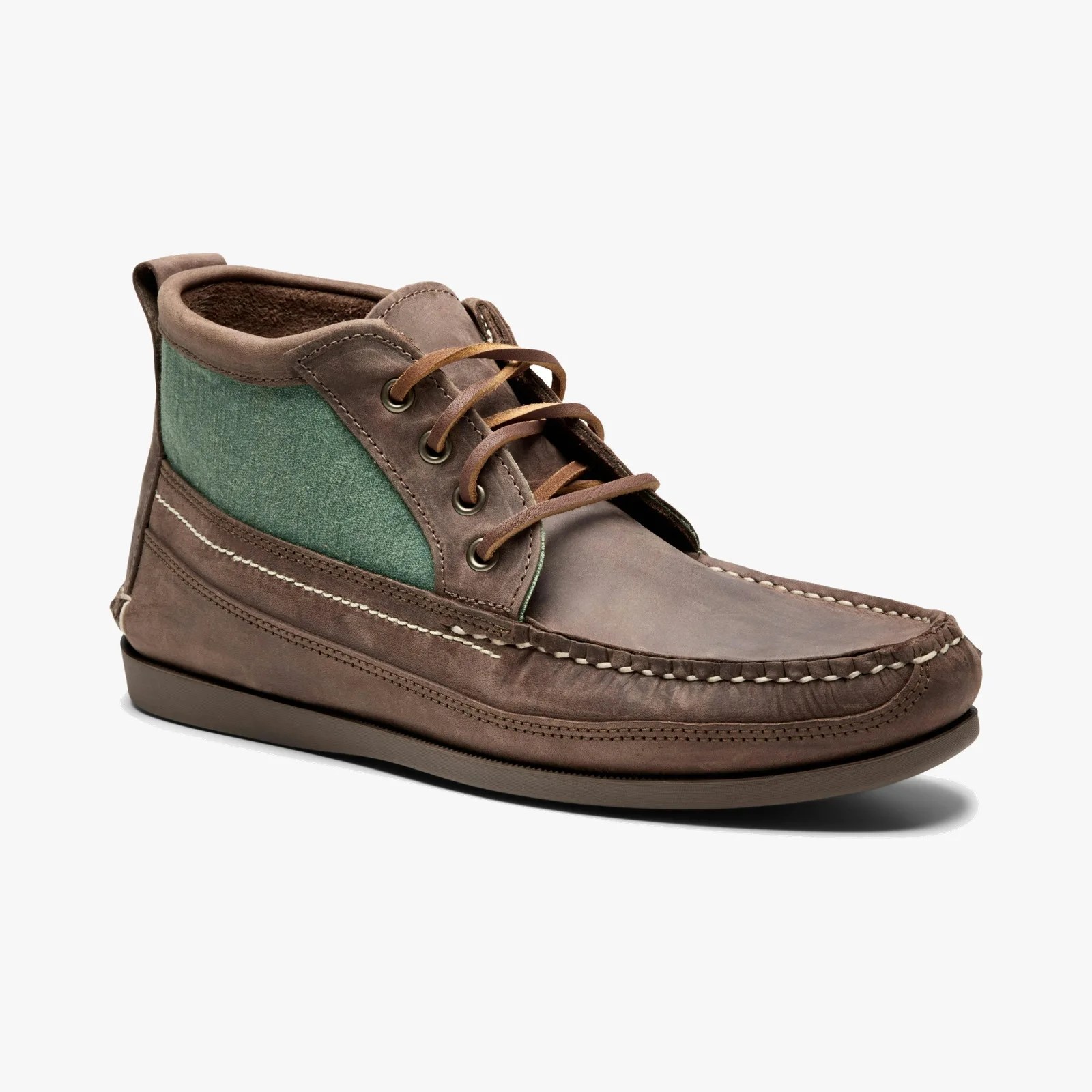 Brown leather and green fabric chukka boot with moc toe stitching and brown laces.