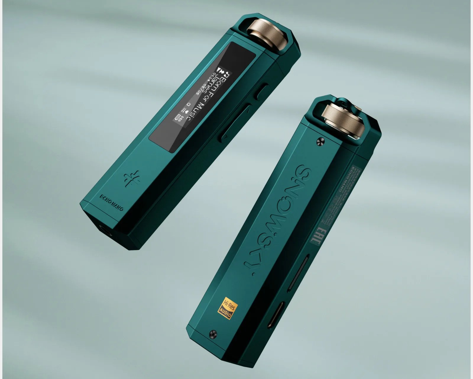 Two teal rectangular digital audio players with gold rotary knobs and black buttons, one showing a screen with text.