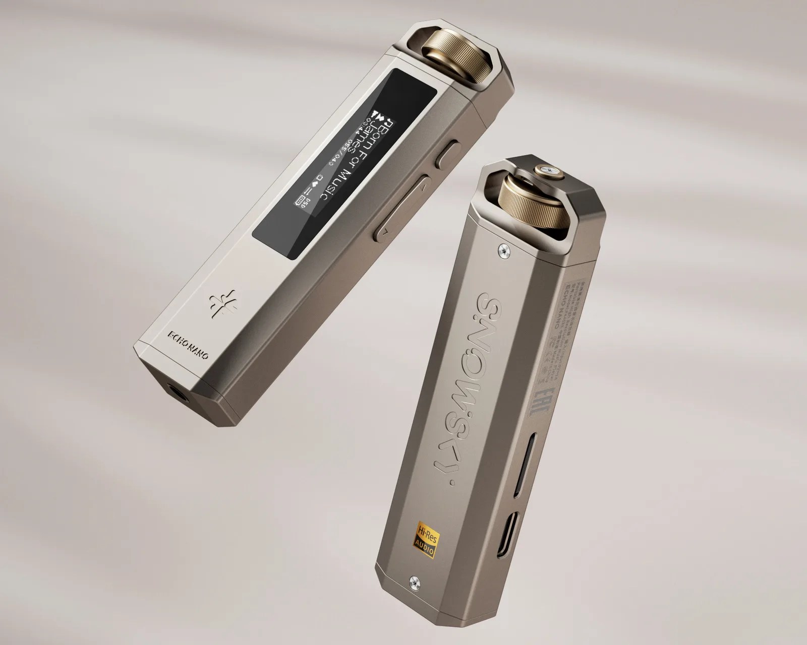 Two metallic portable music players with gold control dials, one showing a screen with text and the other displaying "SNOWSKY" branding.
