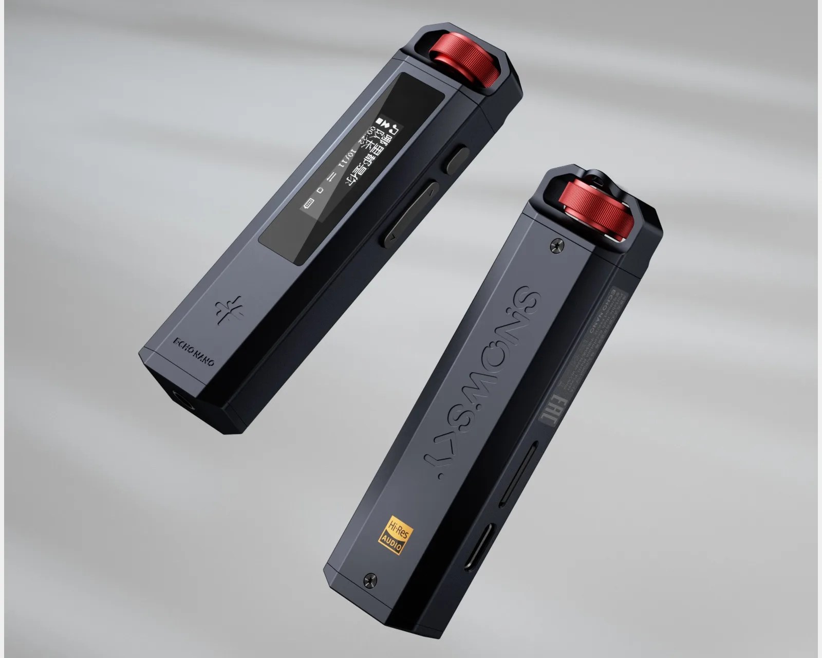 Two black rectangular digital audio players with red rotary knobs and small display screens, one showing Chinese text.