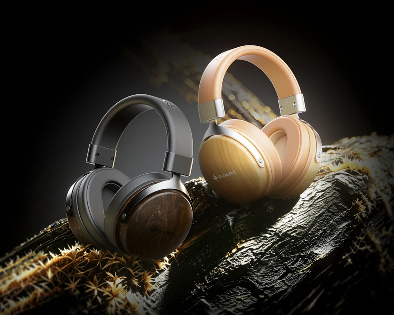 Two pairs of over-ear headphones with wooden ear cups, one in dark wood with black padding and the other in light wood with beige padding, placed on a textured surface.