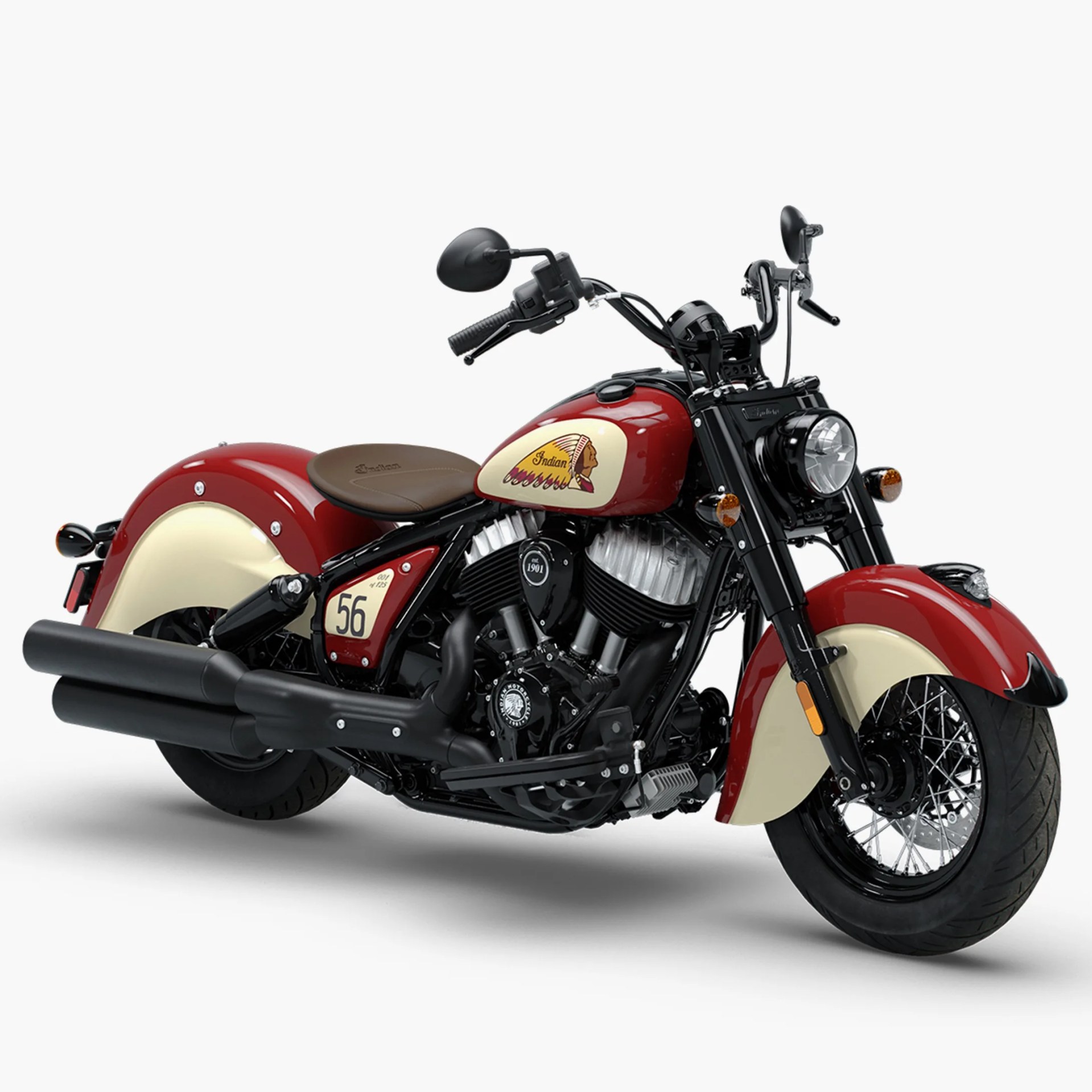 Red and cream Indian motorcycle with black engine, brown leather seat, and black exhaust pipes.