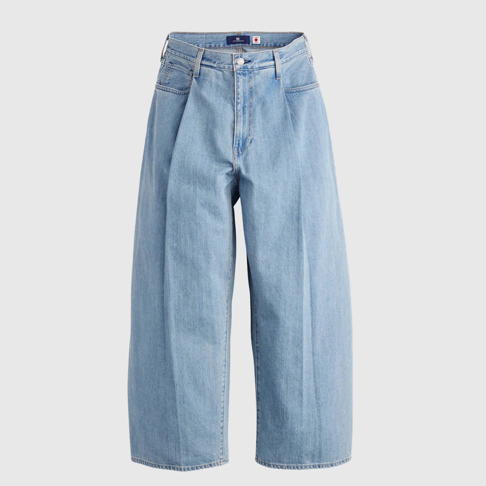 Light blue wide-leg denim shorts with front button and belt loops on a plain background.