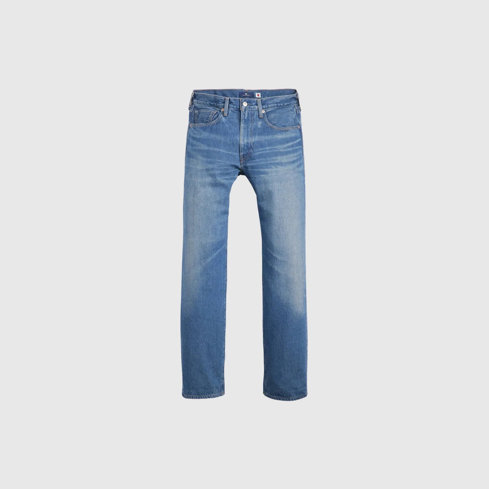 Blue straight-leg jeans with a faded wash and classic five-pocket design on a gray background.
