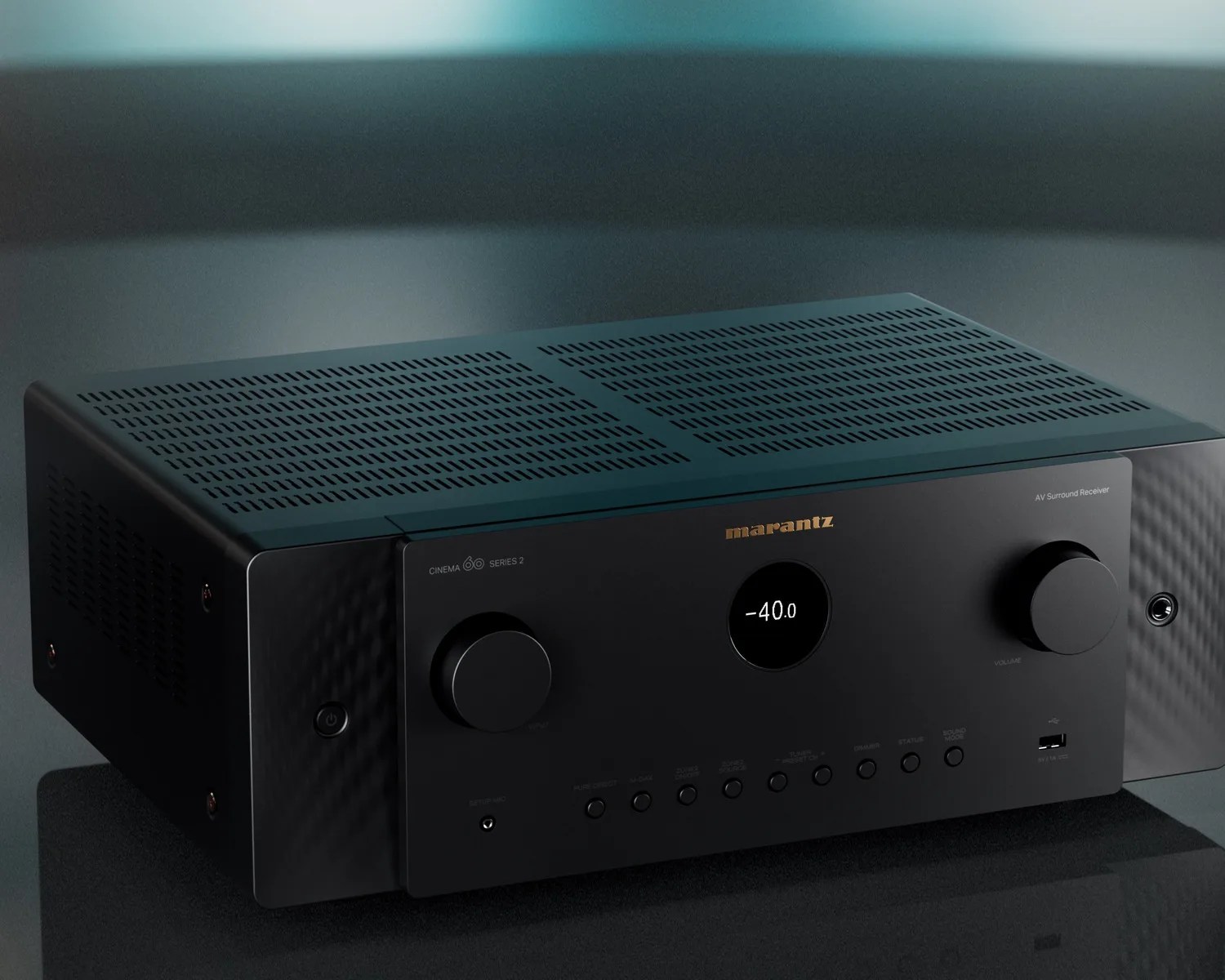 Black Marantz AV surround receiver with digital display and control knobs on a dark surface.