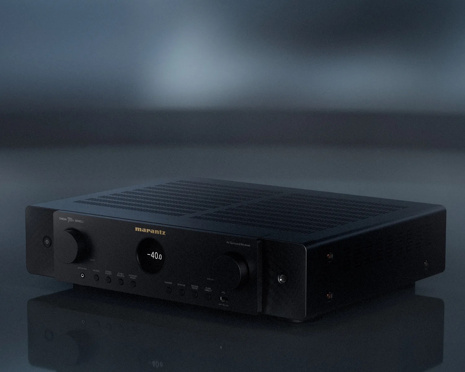 Black Marantz AV surround receiver with digital display showing volume -40.0 on a reflective surface.