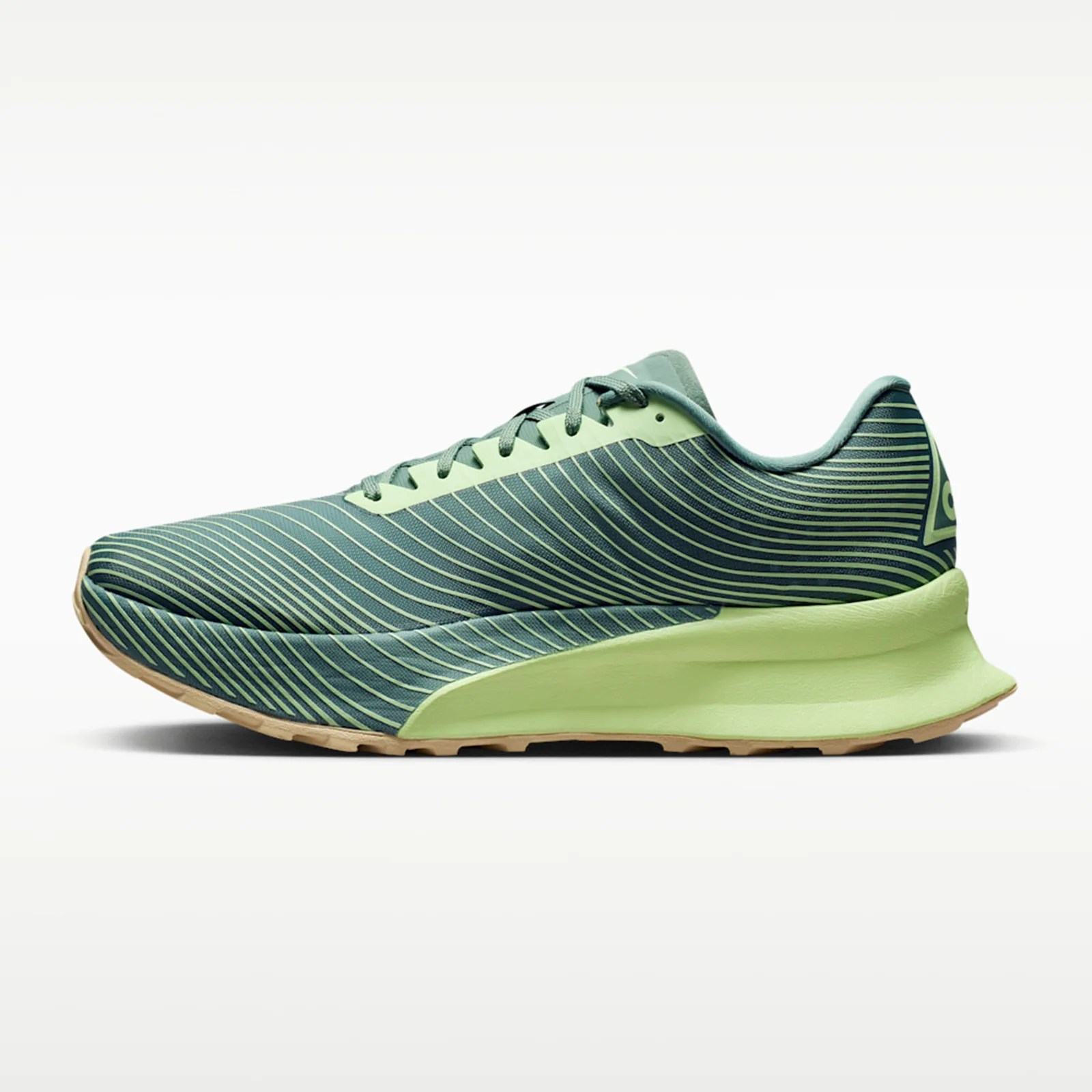 Green and light green running shoe with striped pattern and thick sole.