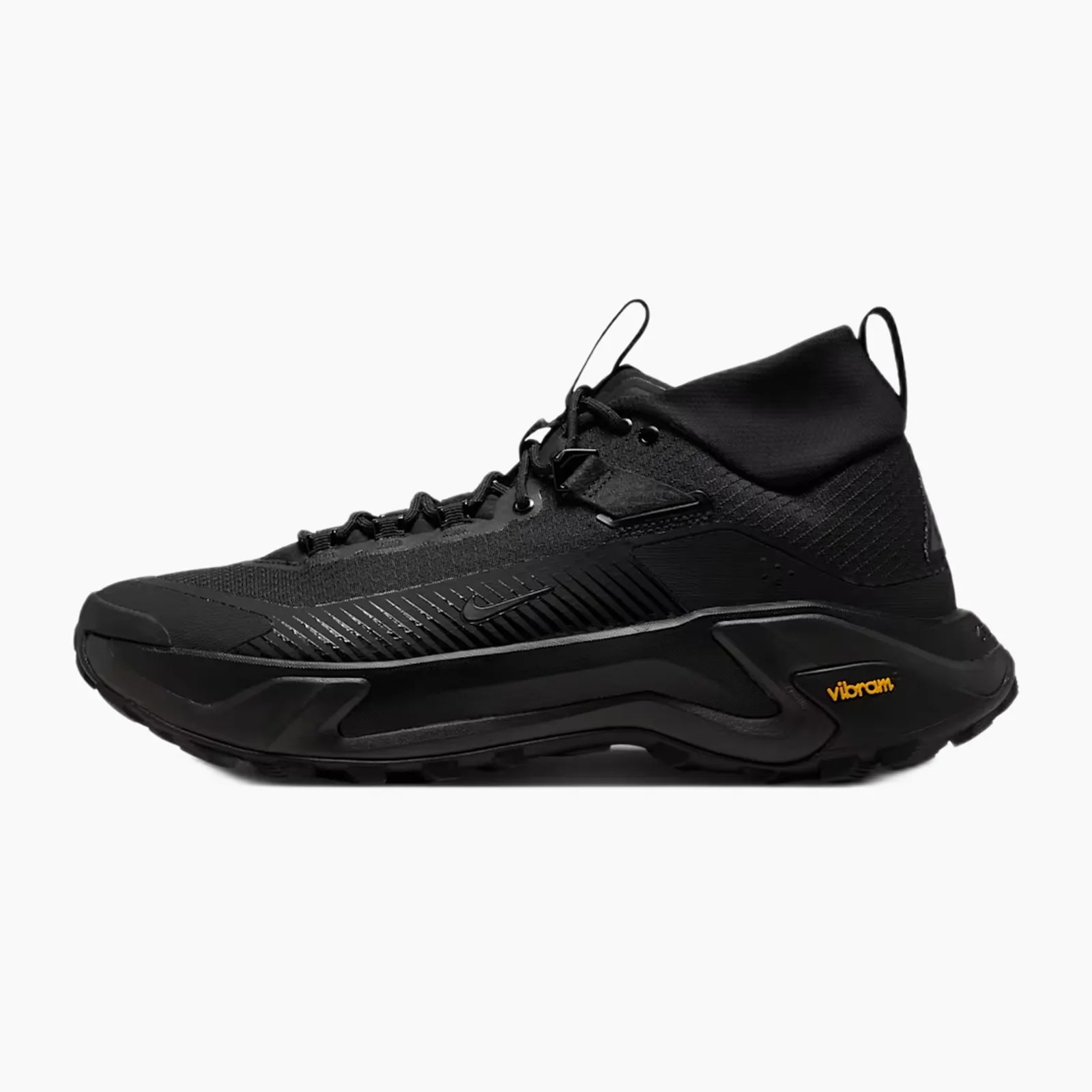 Black mid-top athletic shoe with textured upper, lace-up closure, and Vibram sole branding in yellow.