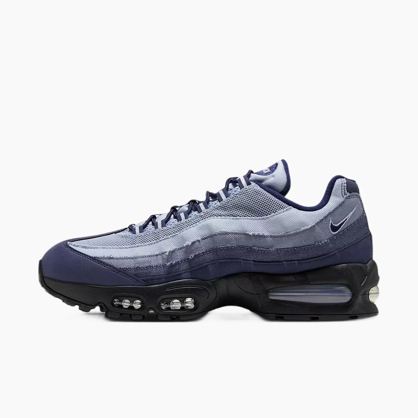 Navy and light blue Nike Air Max 95 sneaker with visible air cushioning and mesh upper.