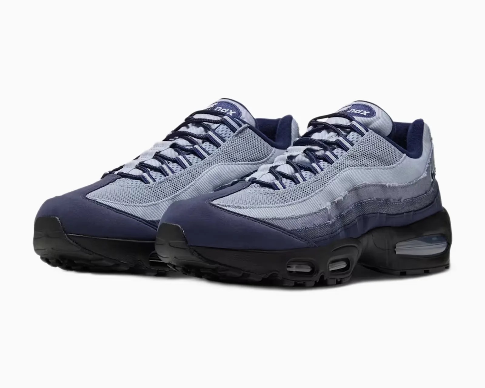 Pair of Nike Air Max 95 sneakers in shades of blue with black soles and visible air cushioning.