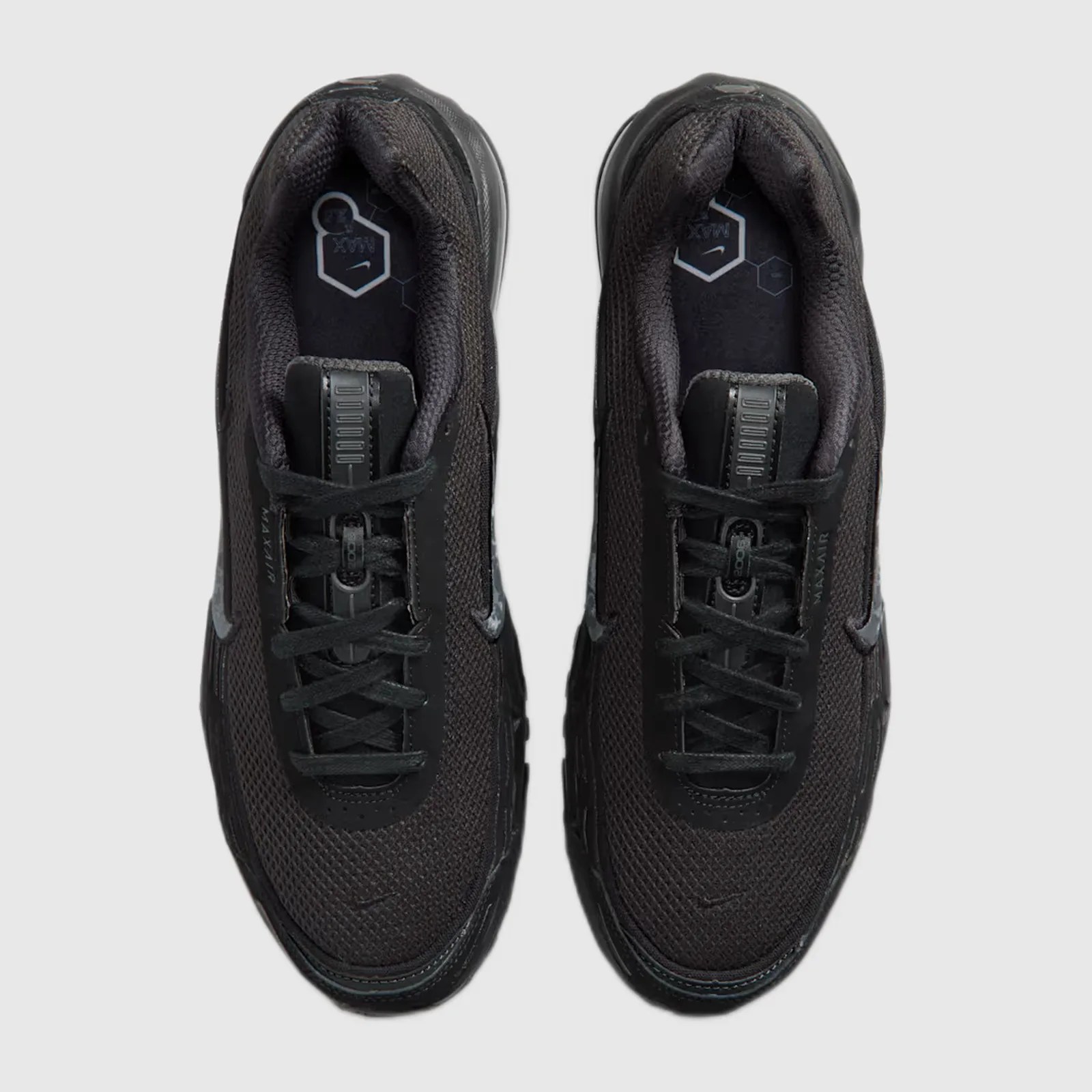 Pair of black Nike Air Max sneakers with mesh uppers and black laces viewed from above.
